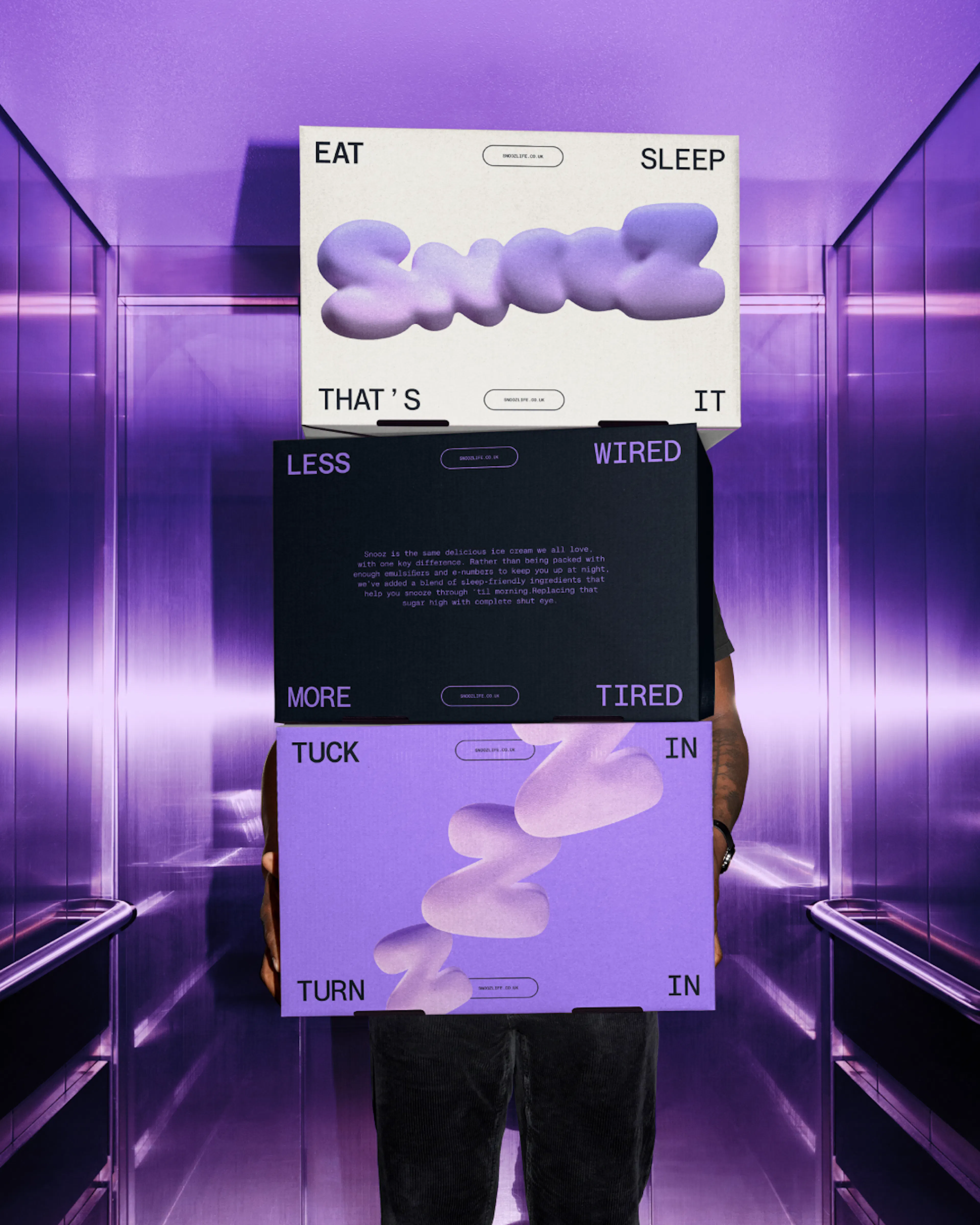 Image of man holding Snooz boxes