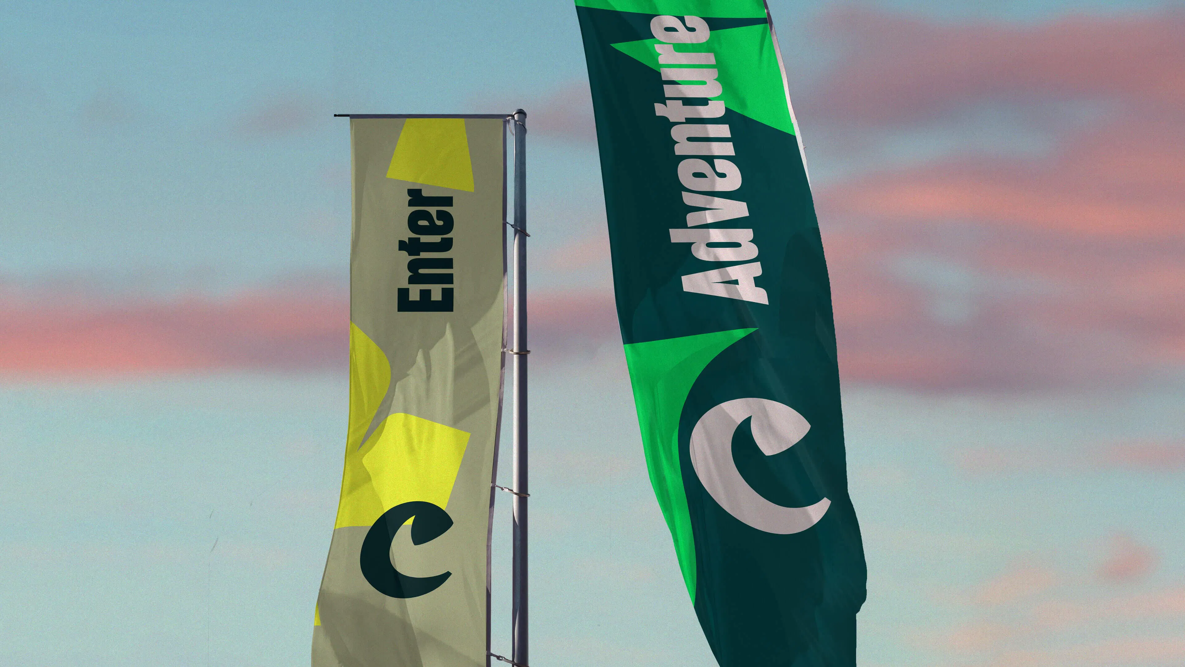 Chester Zoo flags reading 'Enter' and 'Adventure' against the sky