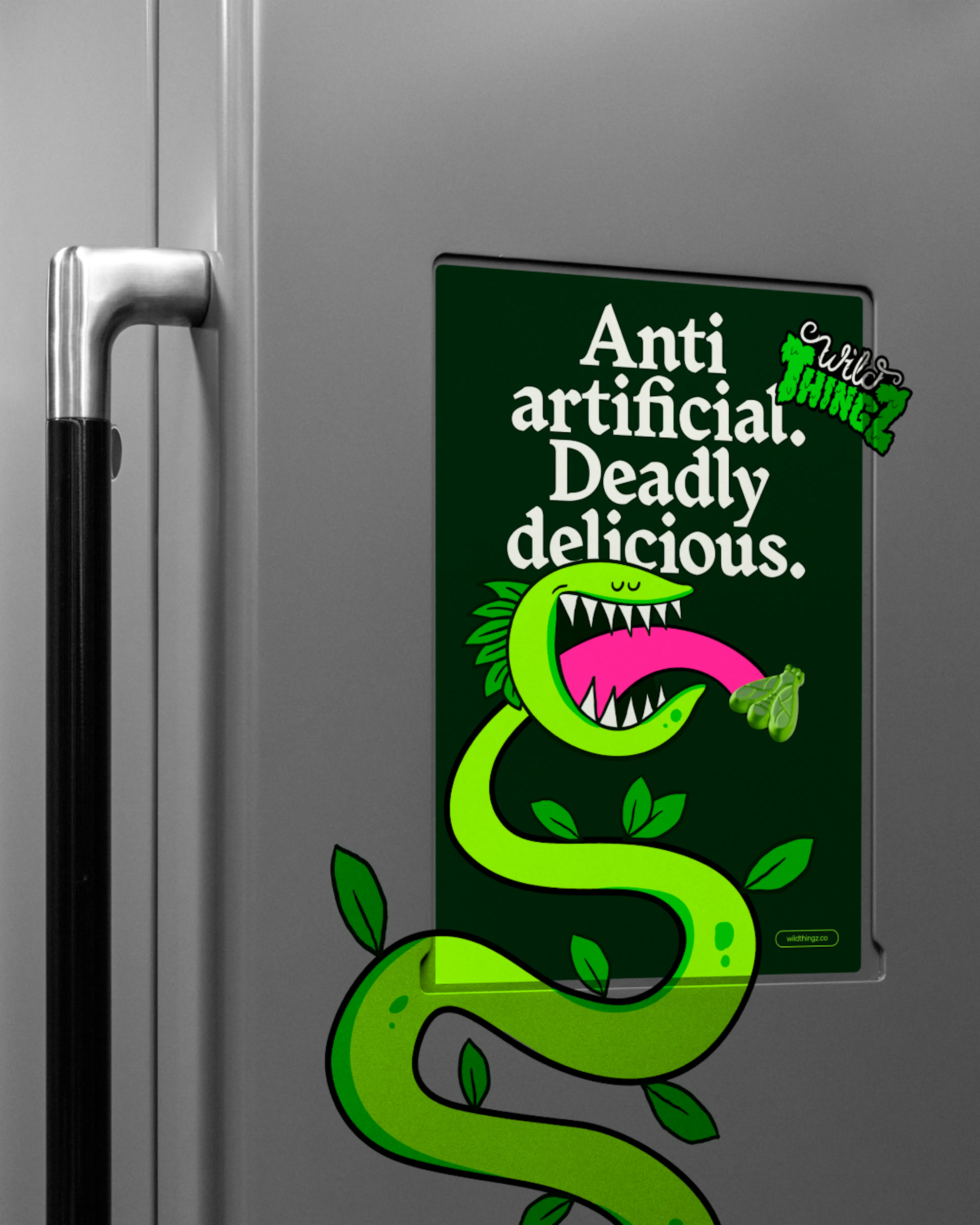 Wild Thingz poster on a fridge reading 'Anti artificial. Deadly delicious.' with Vee the Venus flytrap