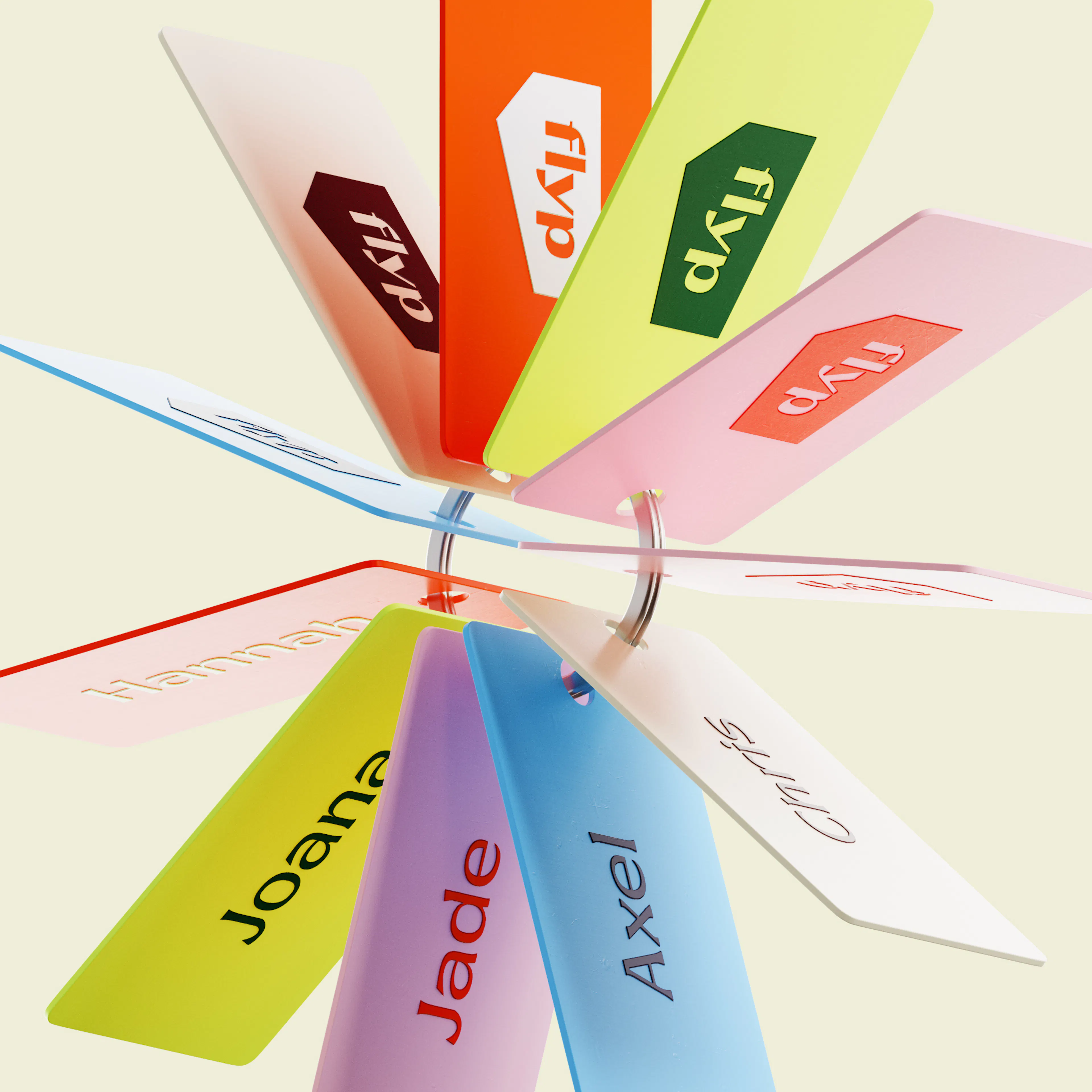 Fan of colourful flyp key tags with team names such as Joana, Jade and Axel