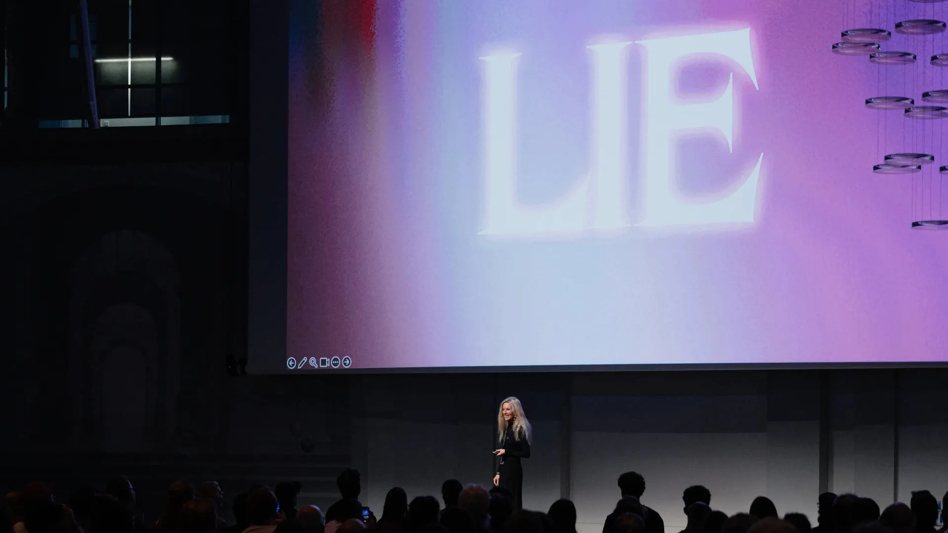 Cat How, founder of HOW+HOW, speaking on stage at the ADC Conference