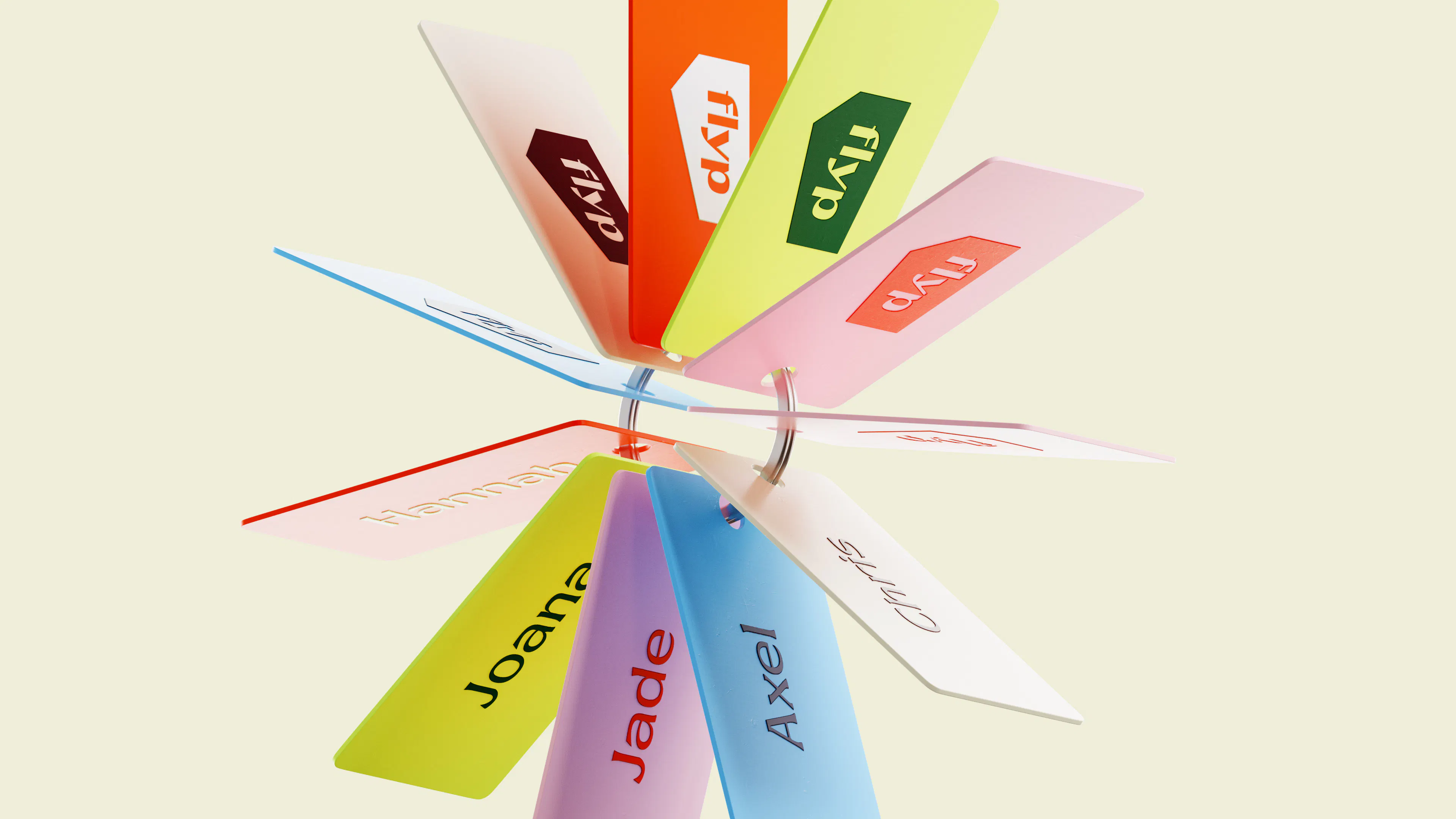 Fan of colourful flyp key tags with team names such as Joana, Jade and Axel