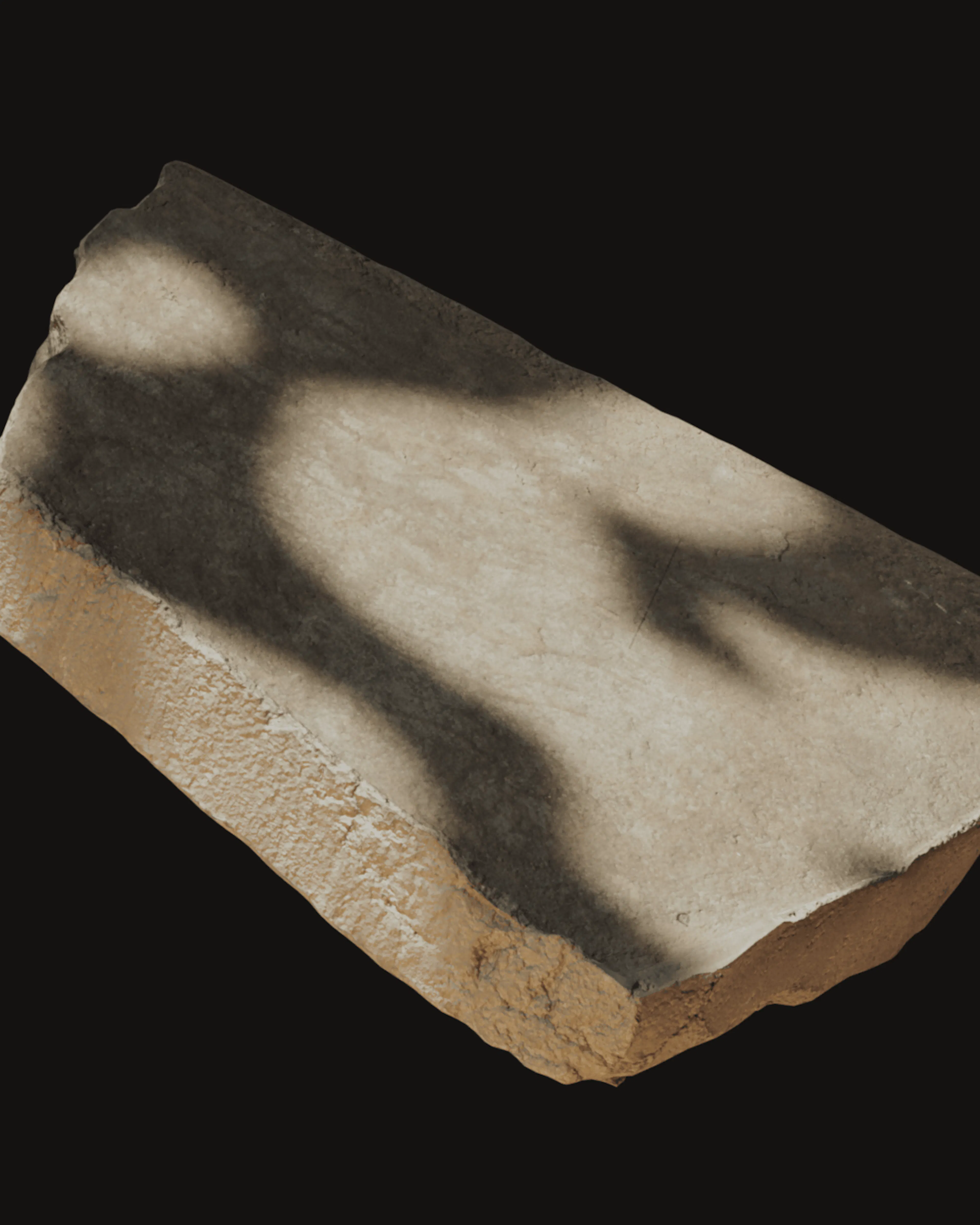 A rough-edged slab of pale bio-concrete with dappled leaf shadows across it, on a black background.