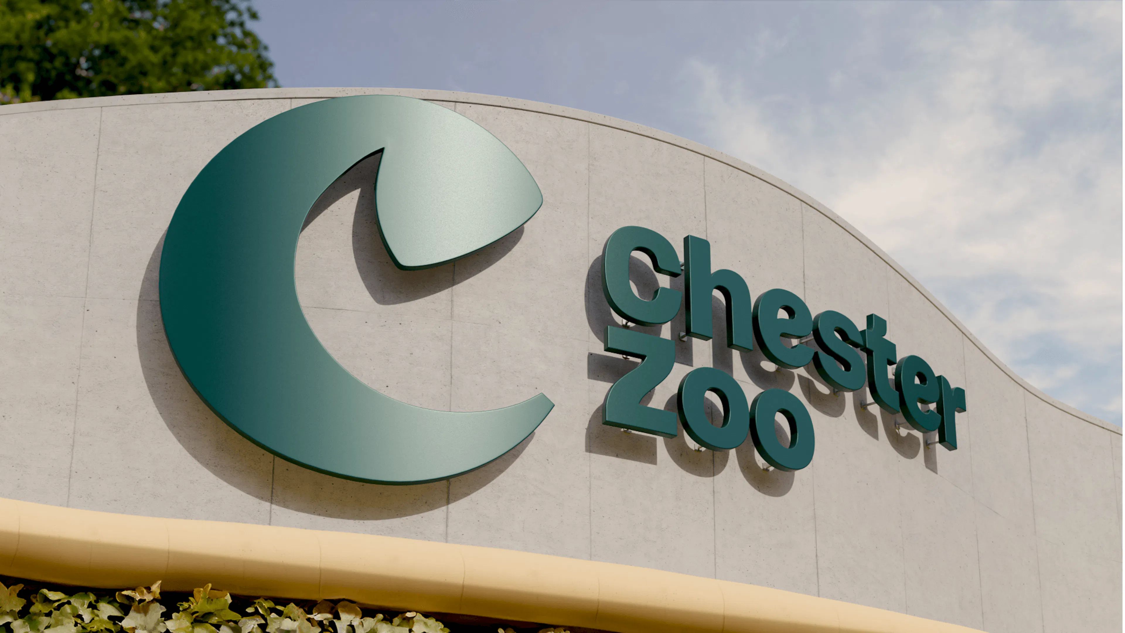Chester Zoo entrance sign with the 'C' icon and wordmark
