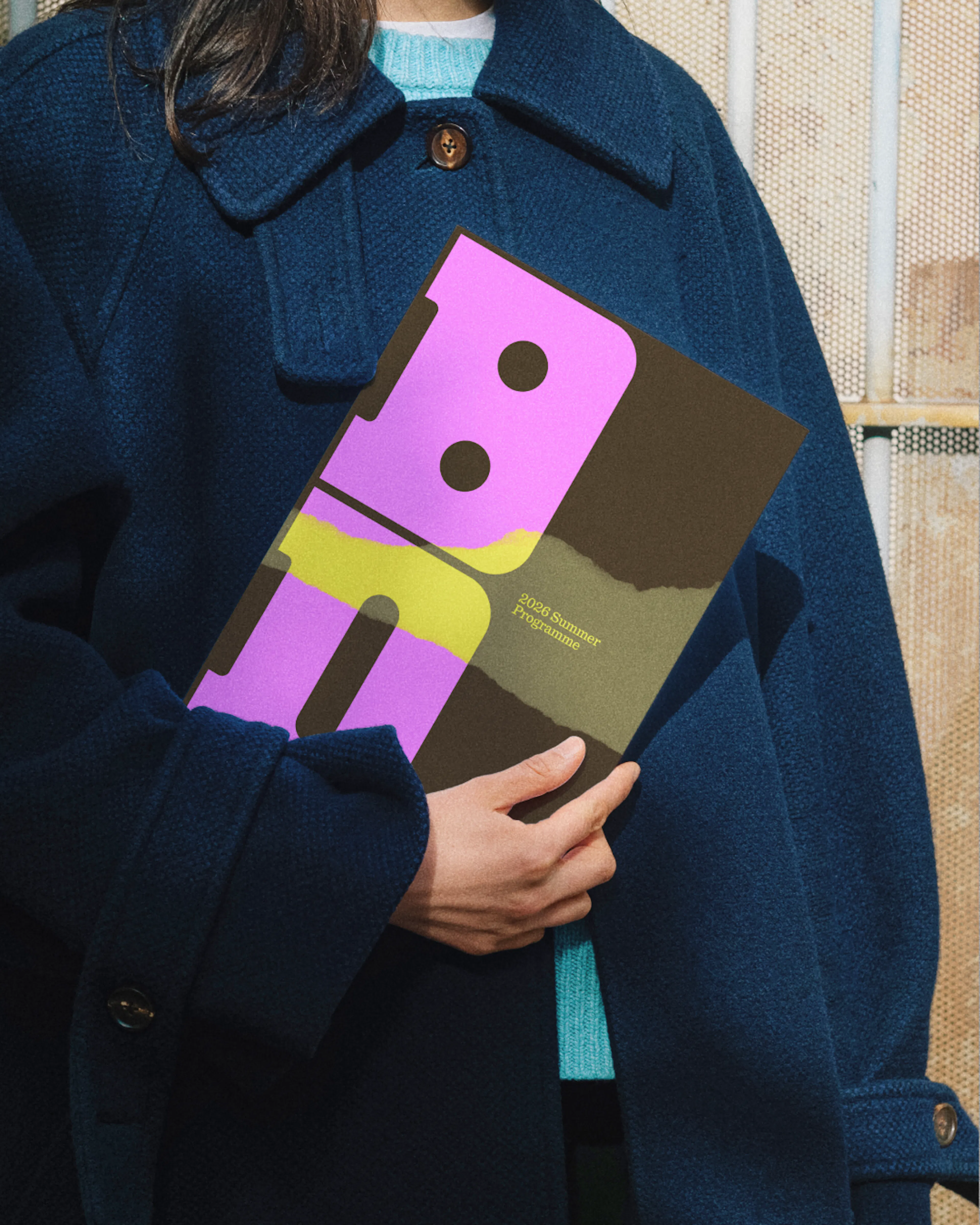 Image of woman holding Bristol Dockyards brochure by HOW+HOW