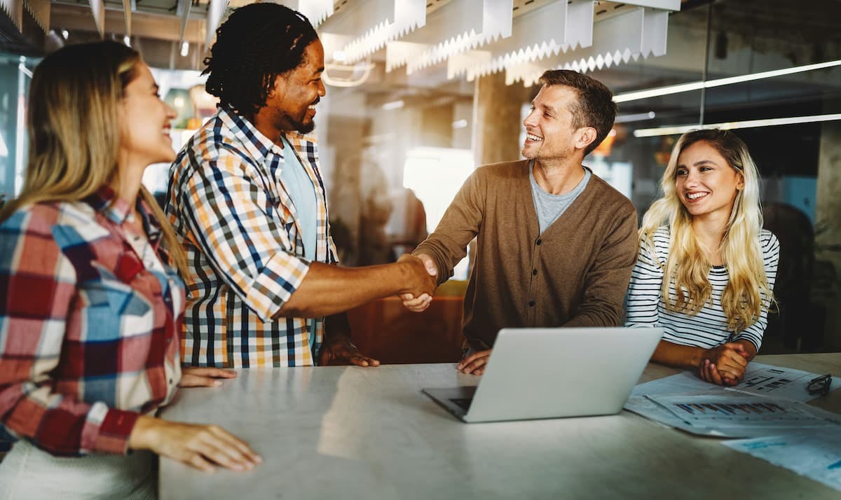 Employees collaborating in a modern office setting.