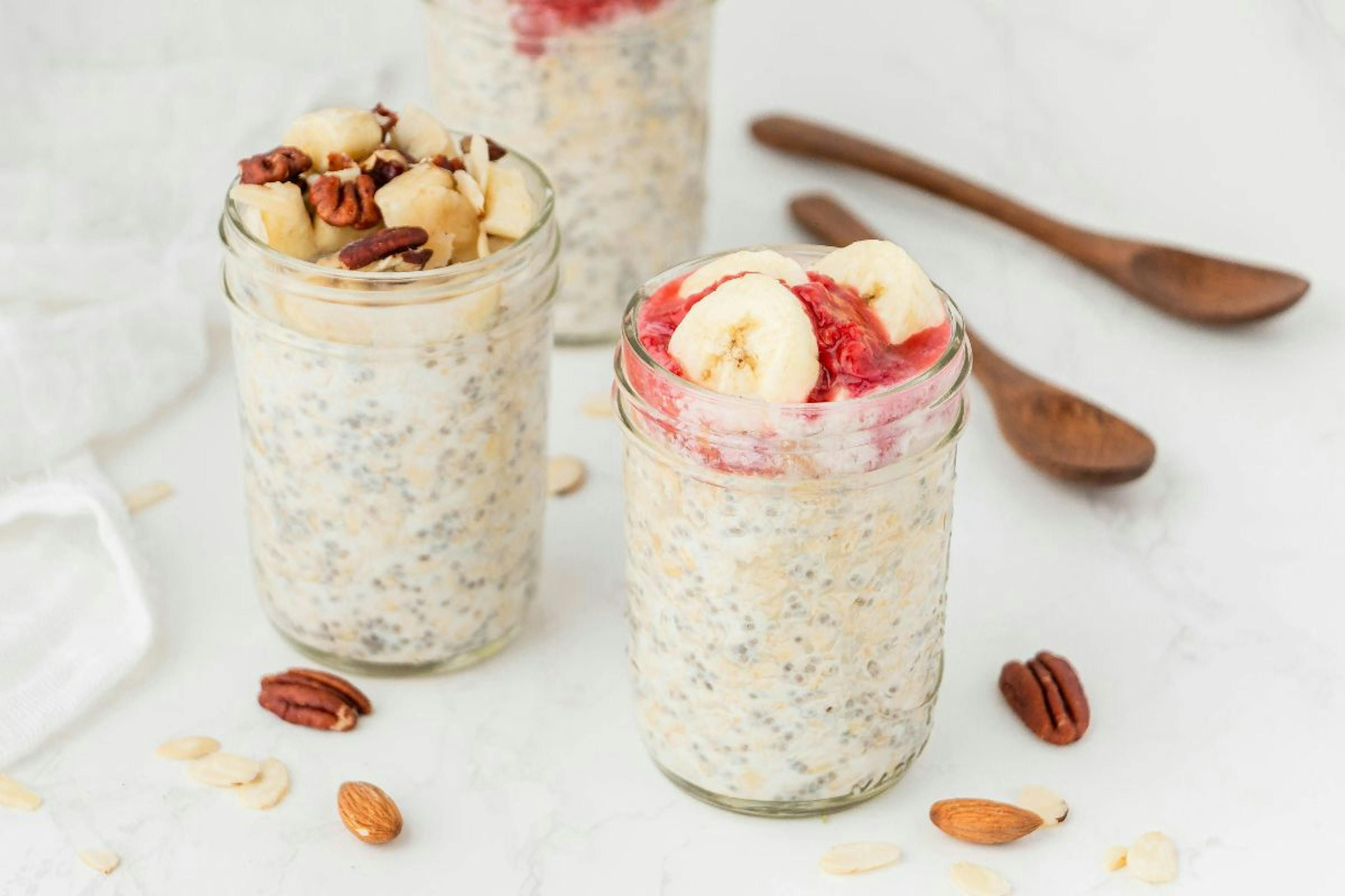 oatmeals in glass cups with fruits