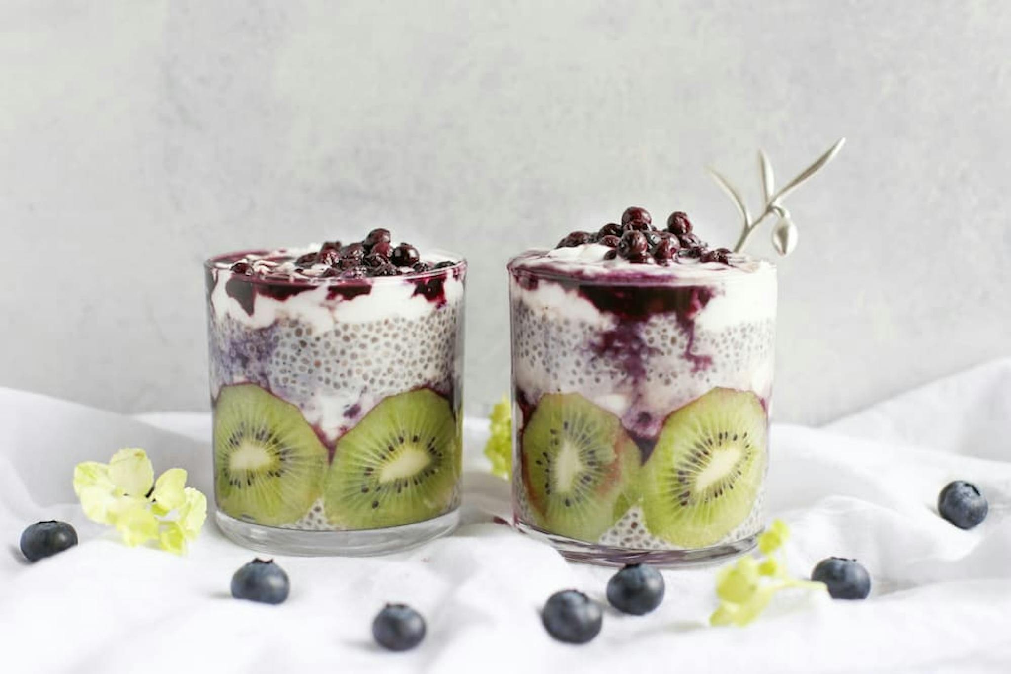 Dessert with layers of chia, kiwi, and berry topping