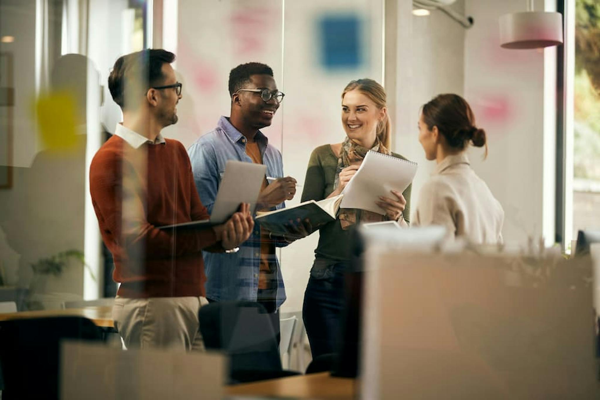 Diverse group of professionals discussing ideas in a collaborative work environment