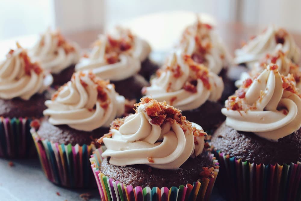 Chocolate cupcakes with buttercream frosting and crunchy bits