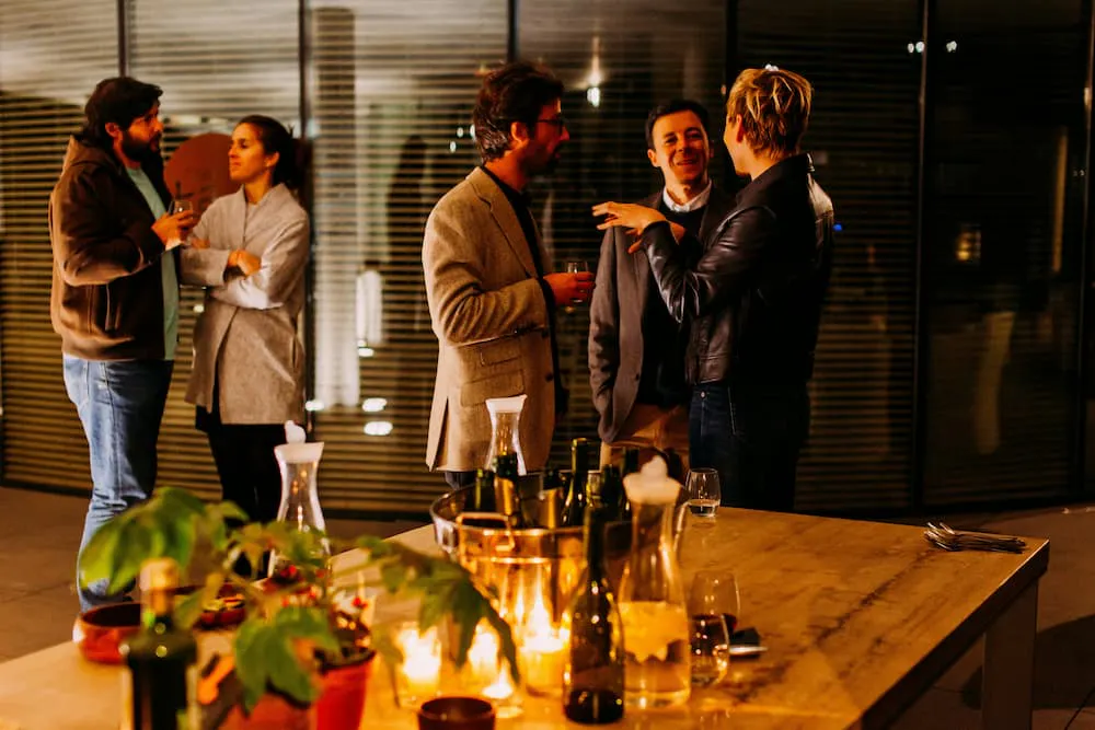 Office colleagues chatting at dining experience