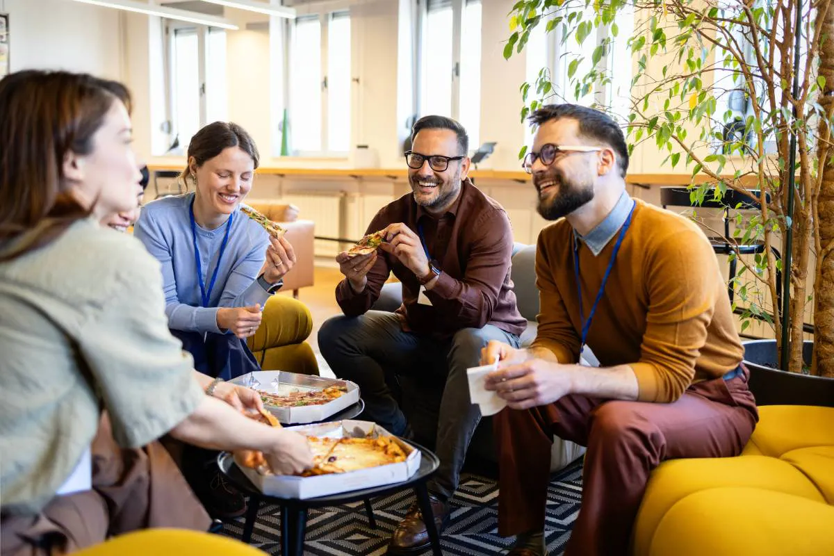 Coworkers enjoying delivered lunch together