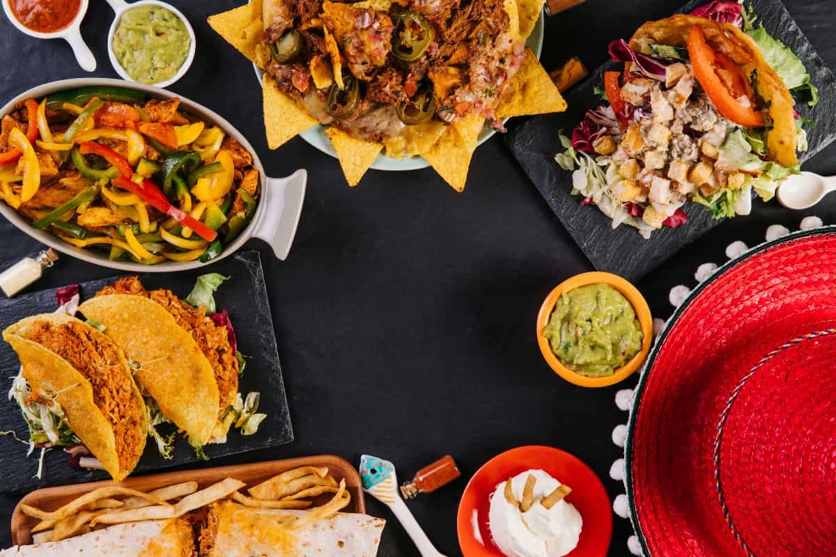 Colorful Mexican dishes with tacos, nachos, and guacamole, perfect for food delivery in Irvine.