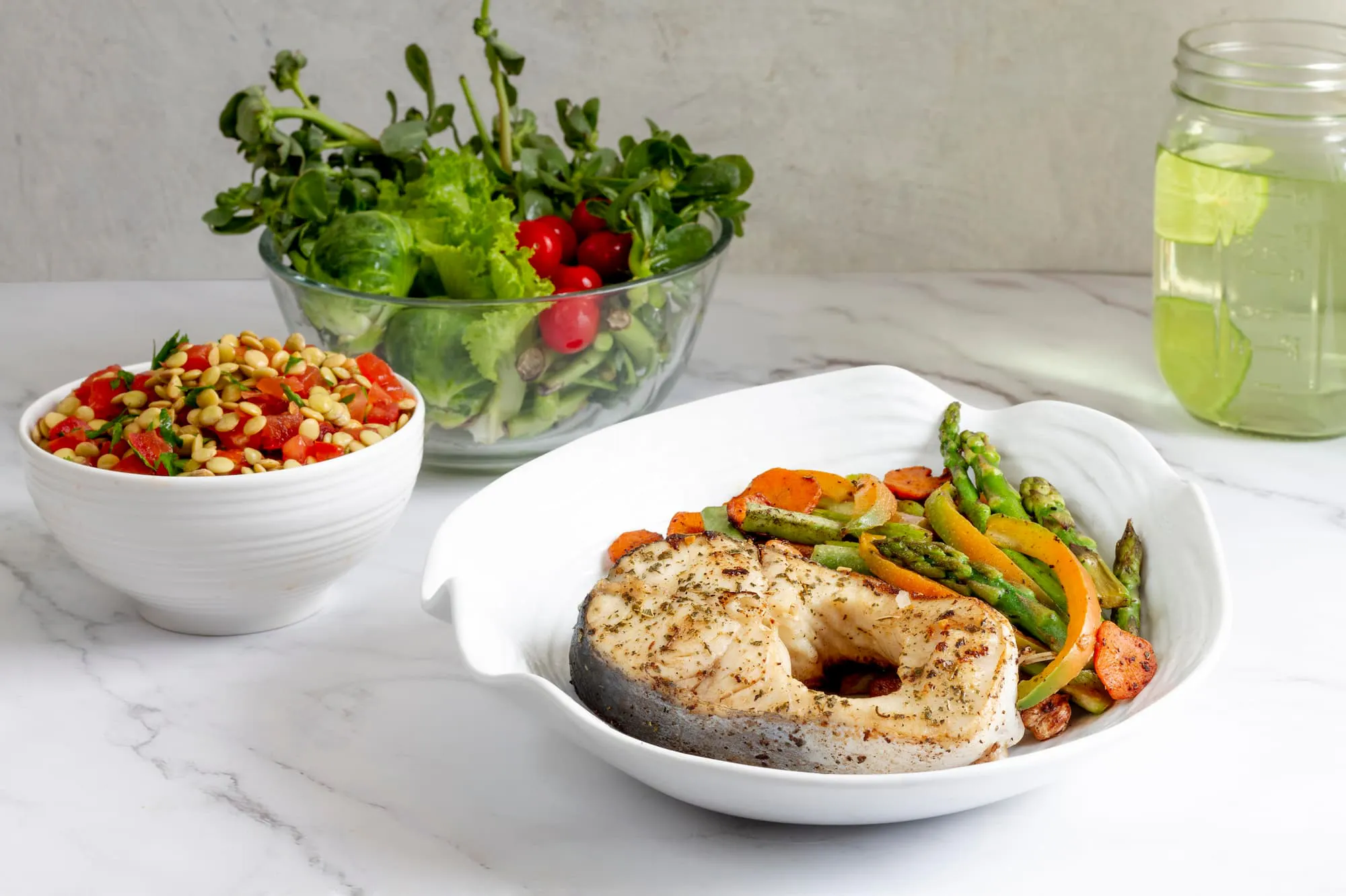 Healthy meal with grilled fish and veggies, perfect for deciding when to switch to bulk meal orders for your diet plan.