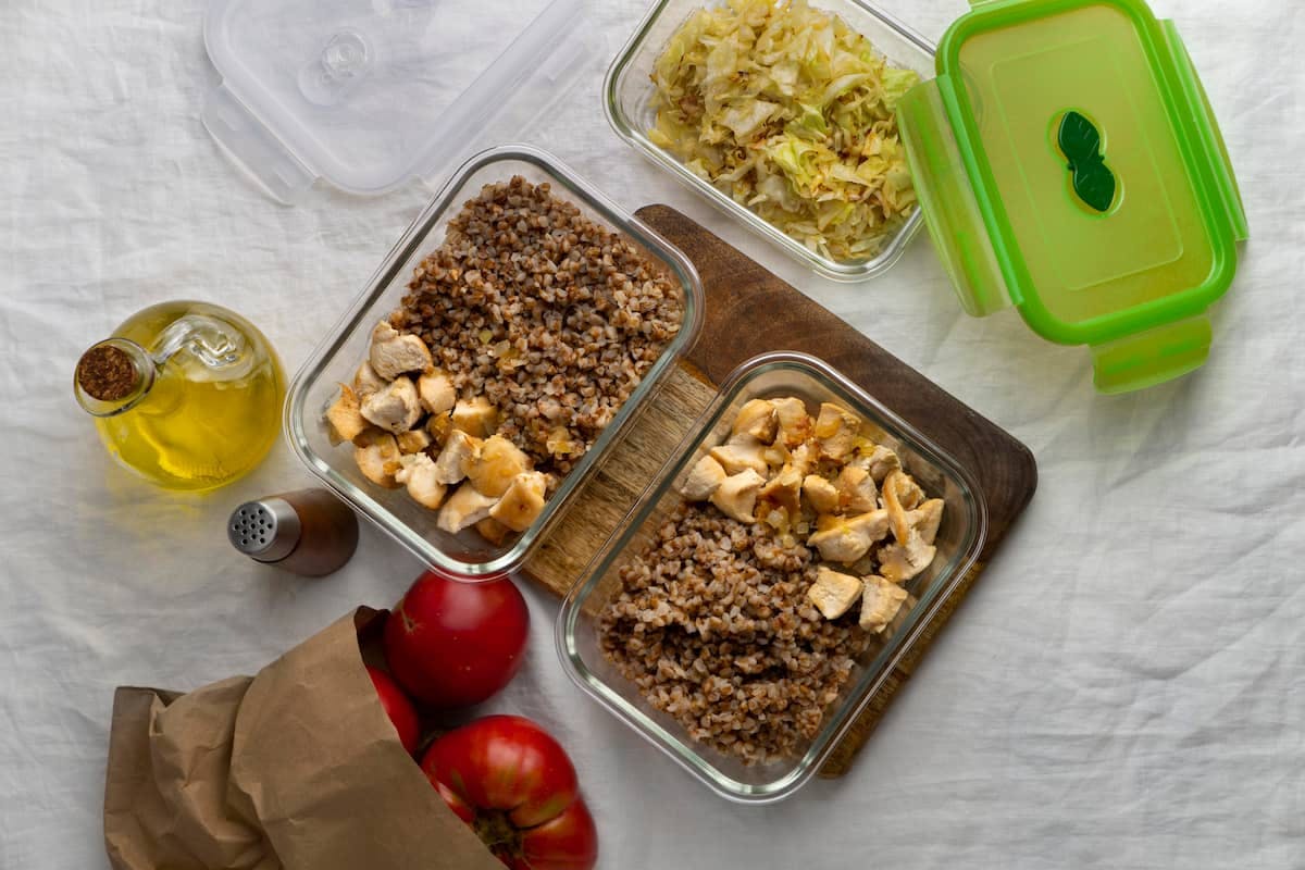 Prepped chicken and grains ready to go—learn when to switch to bulk meal orders to save time and stay on track.