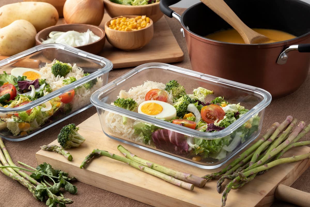 Fresh, healthy meal prep containers showing centralized meal ordering benefits like consistency, nutrition, and convenience.