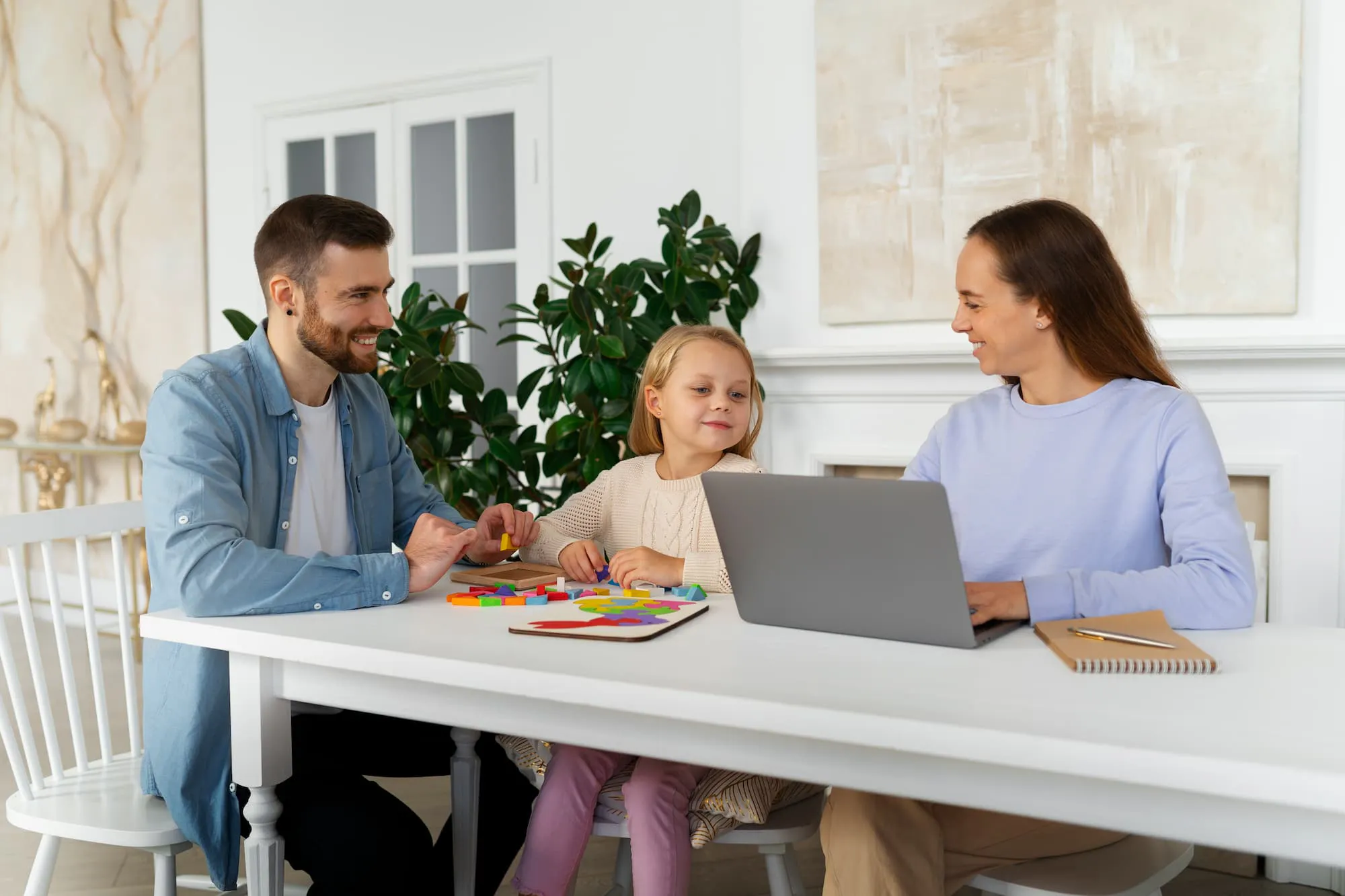 Smiling parents and child at home, symbolizing work-life balance and ideas on how to celebrate parents at work.