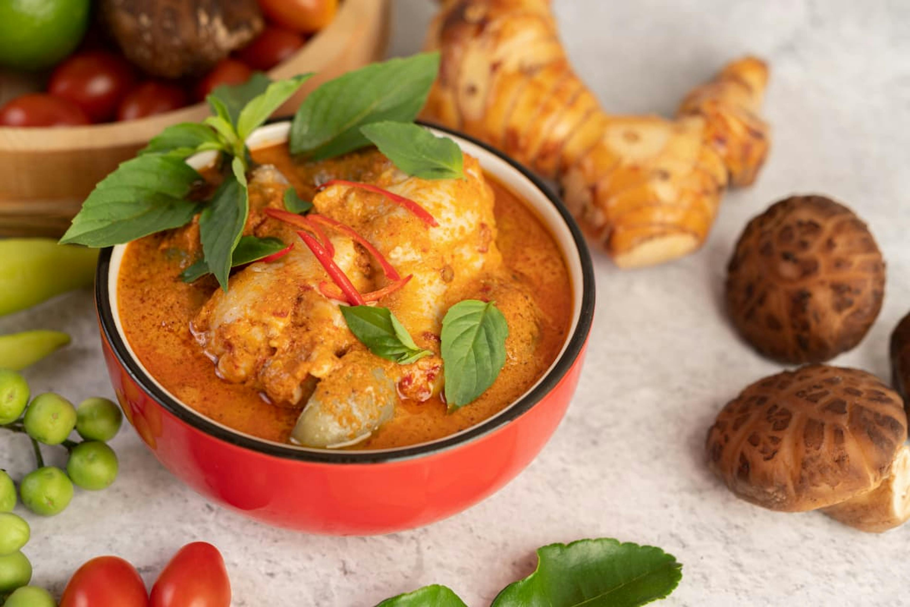 Spicy Thai curry with herbs, perfect for diverse and flavorful corporate catering in San Francisco business events.