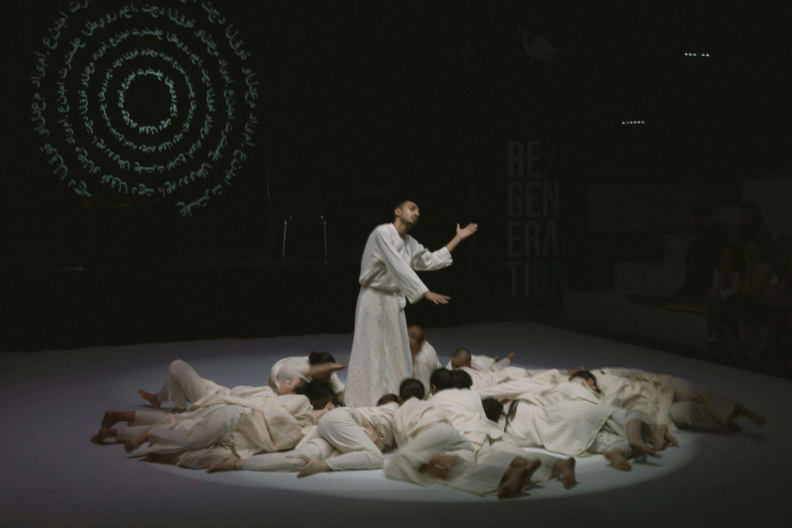 Man poses in center of sleeping people ritual green circles