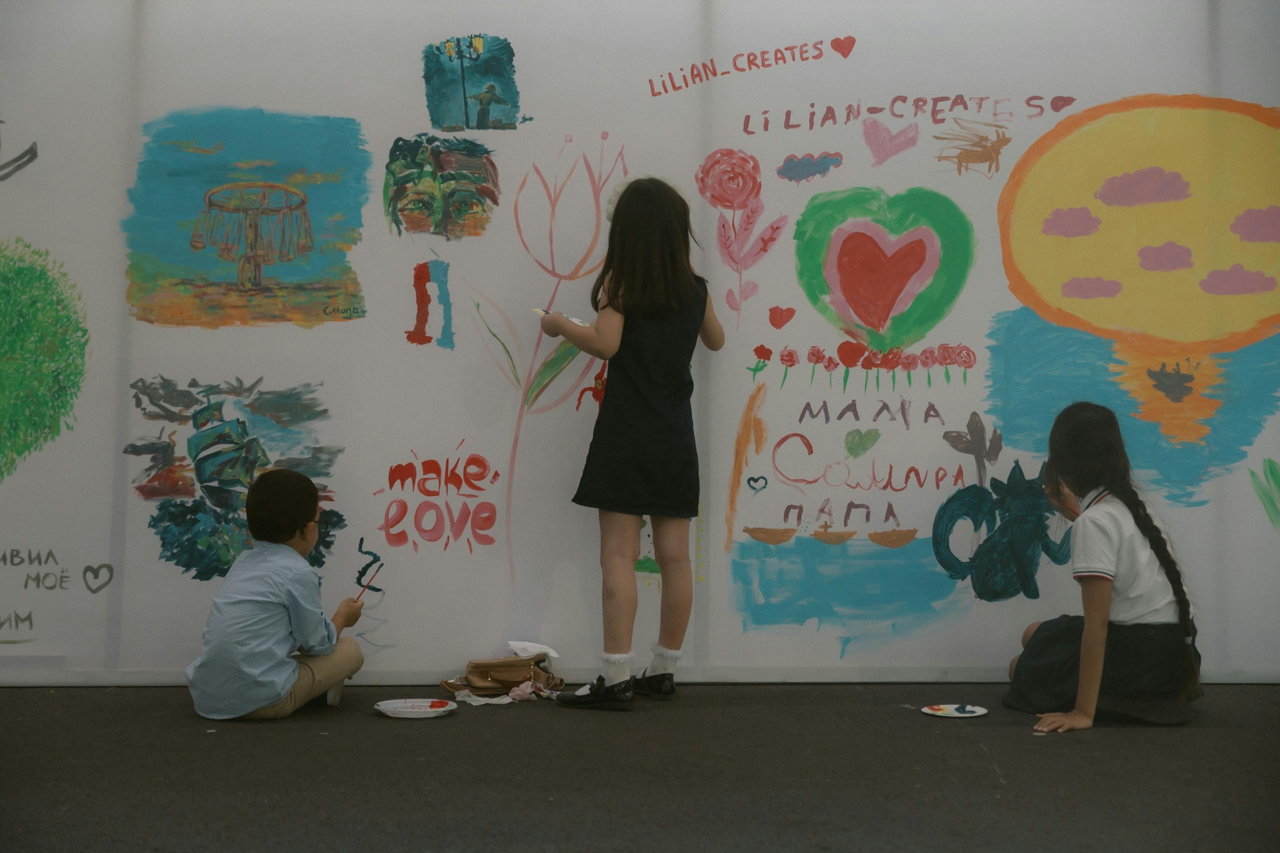 Children drawing on wall