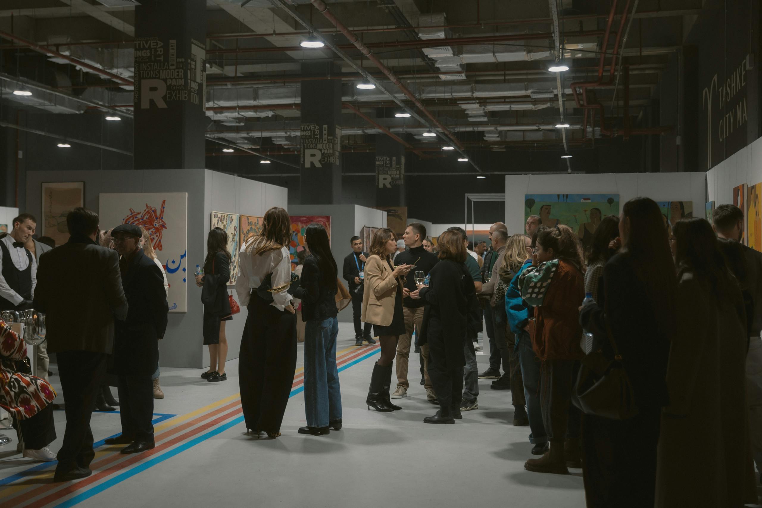 People talking in Art Space gallery