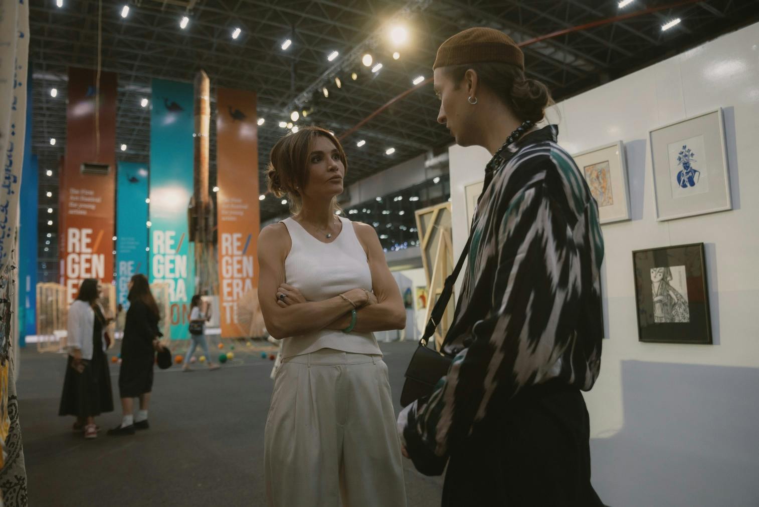 Lola Tillyaeva in discussion with a festival participant at the Re/Generation Art Fest, September 2024, Tashkent