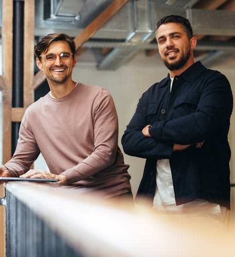 Two people happy with advice from Humancore's AI Coach