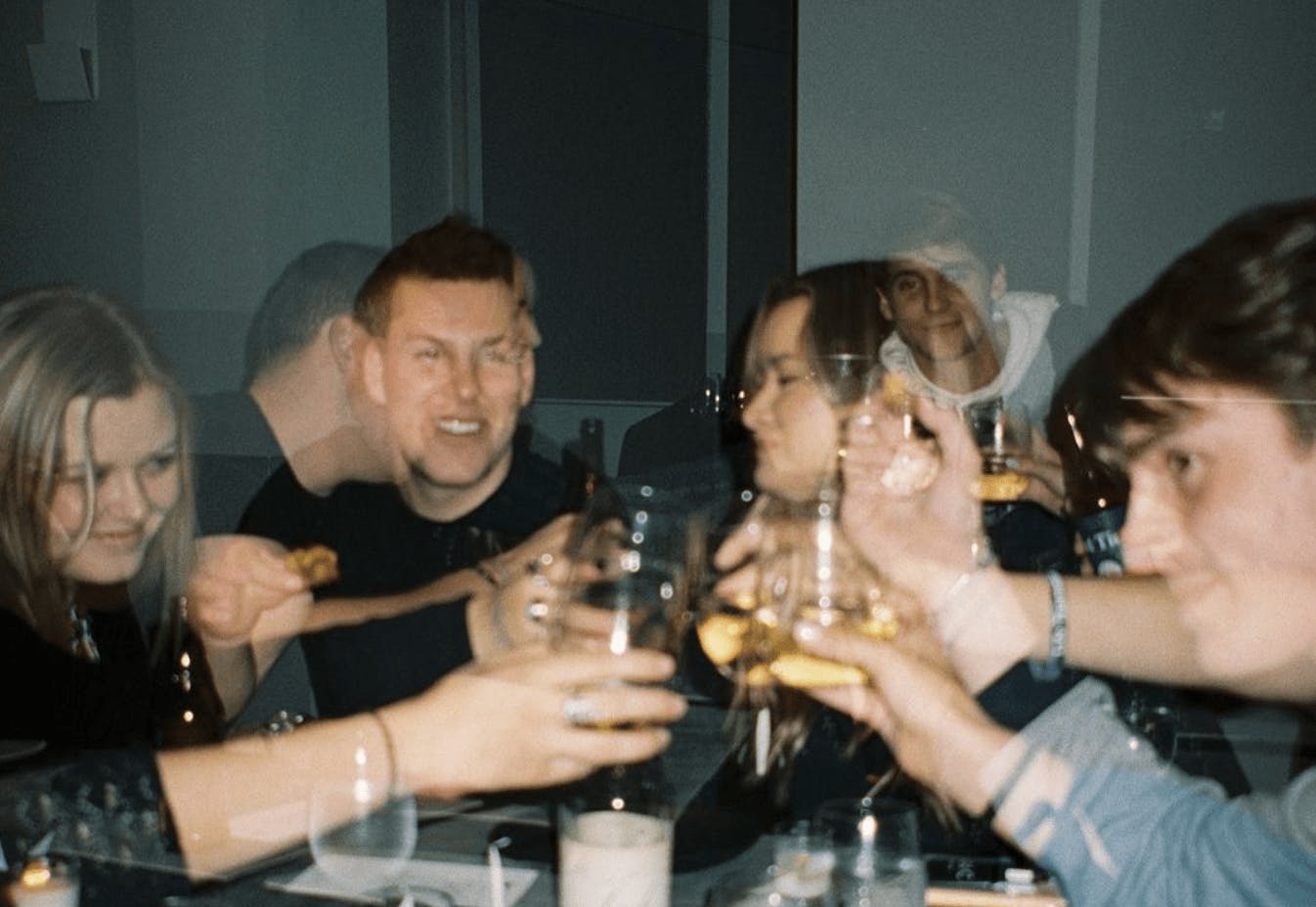 A film photo of people dining together