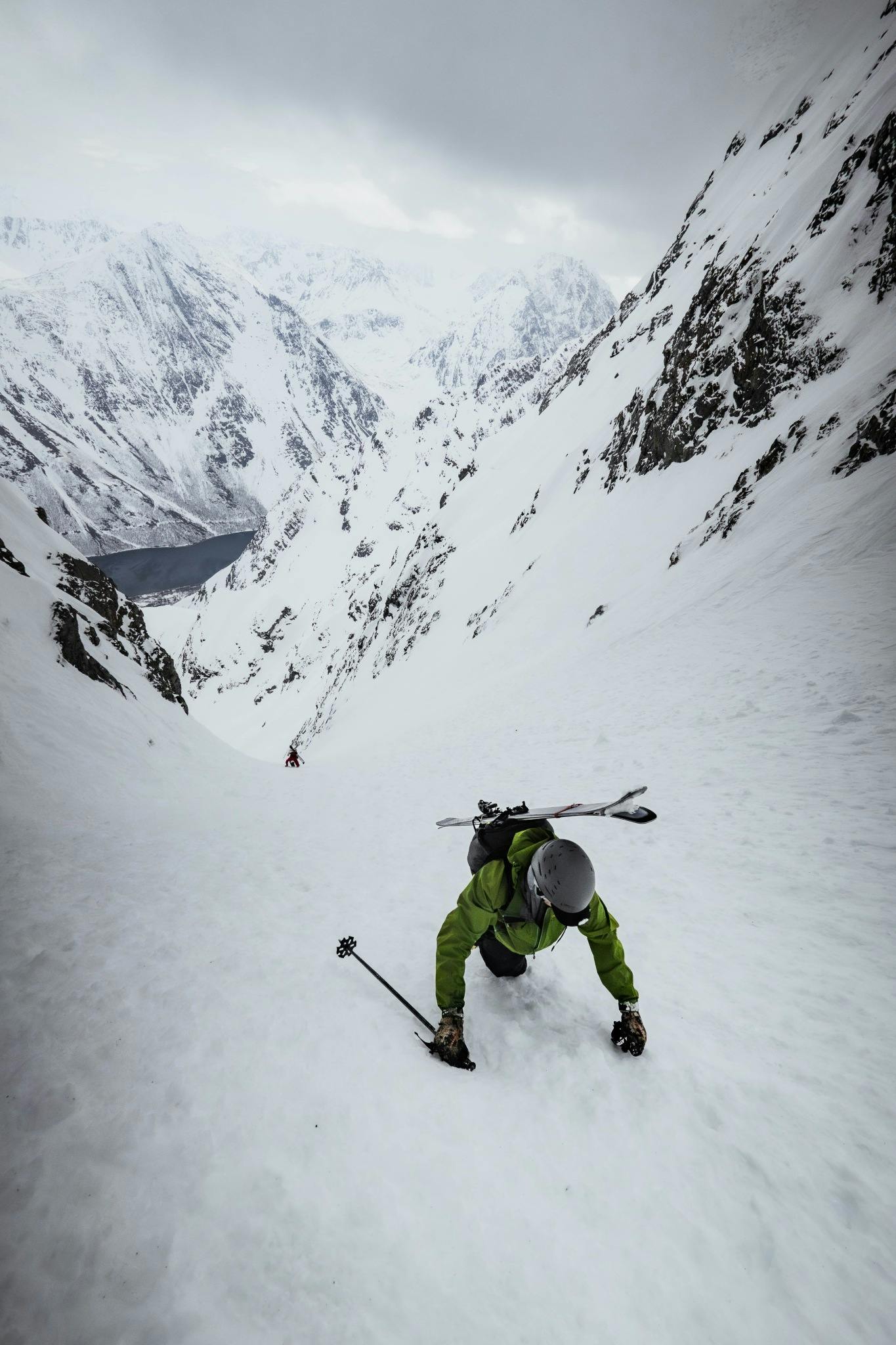 A ski mountaineer climbing a couloir