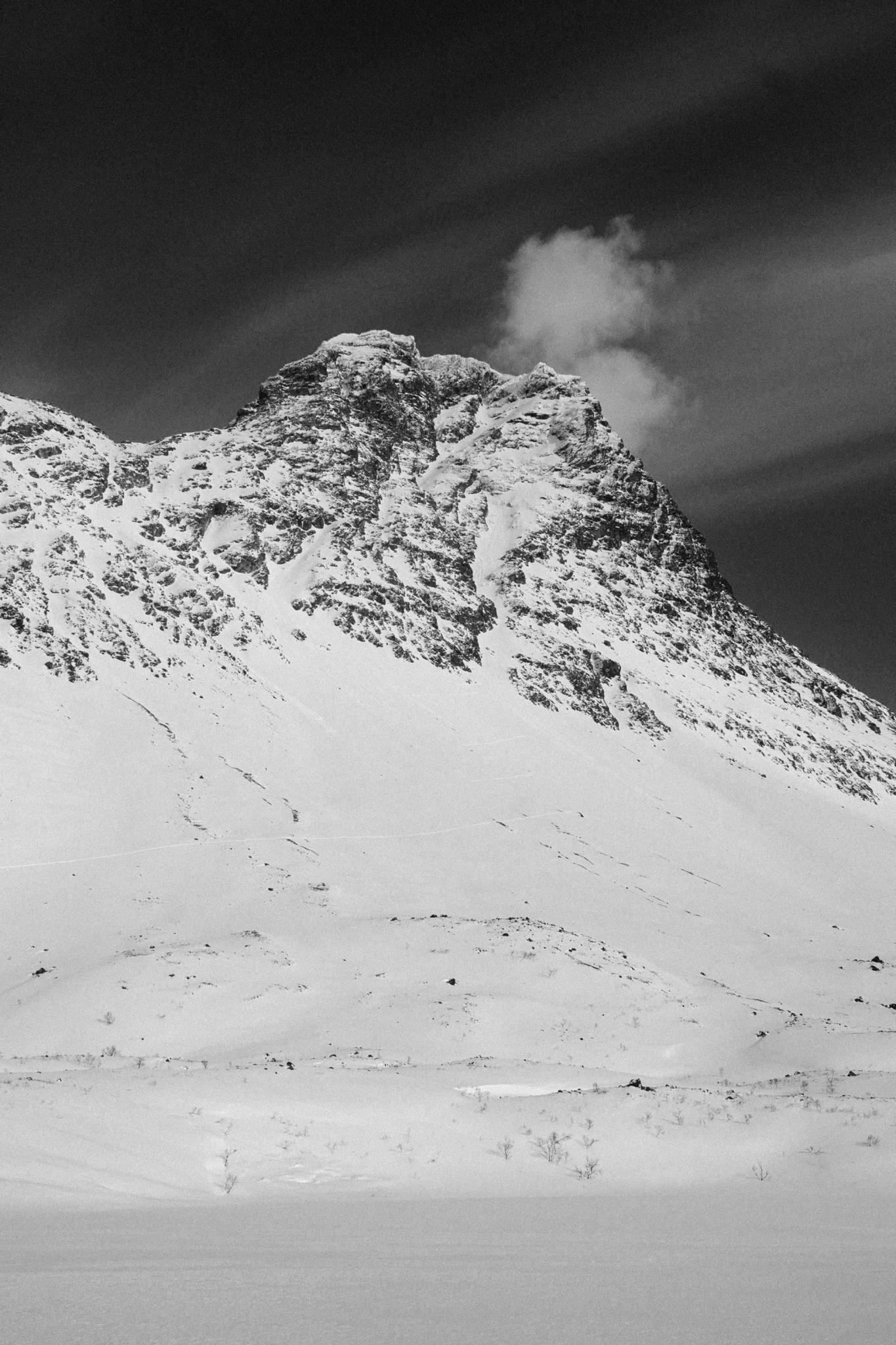 A black and white photo of a mountain