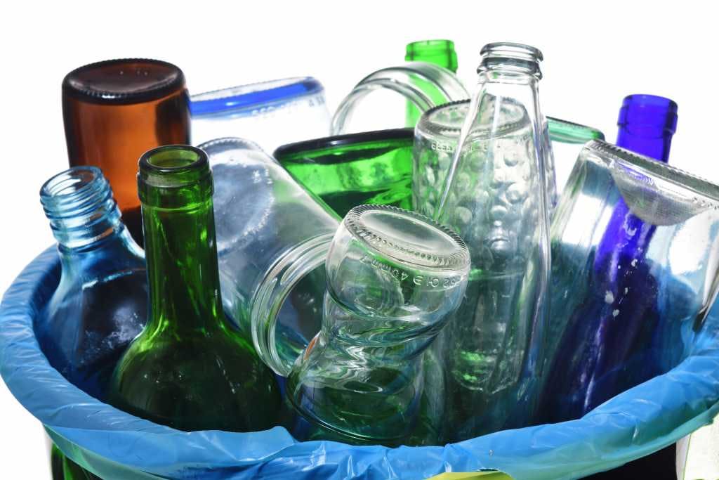 Glass bottles in bin