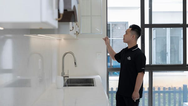 man inspecting kitchen