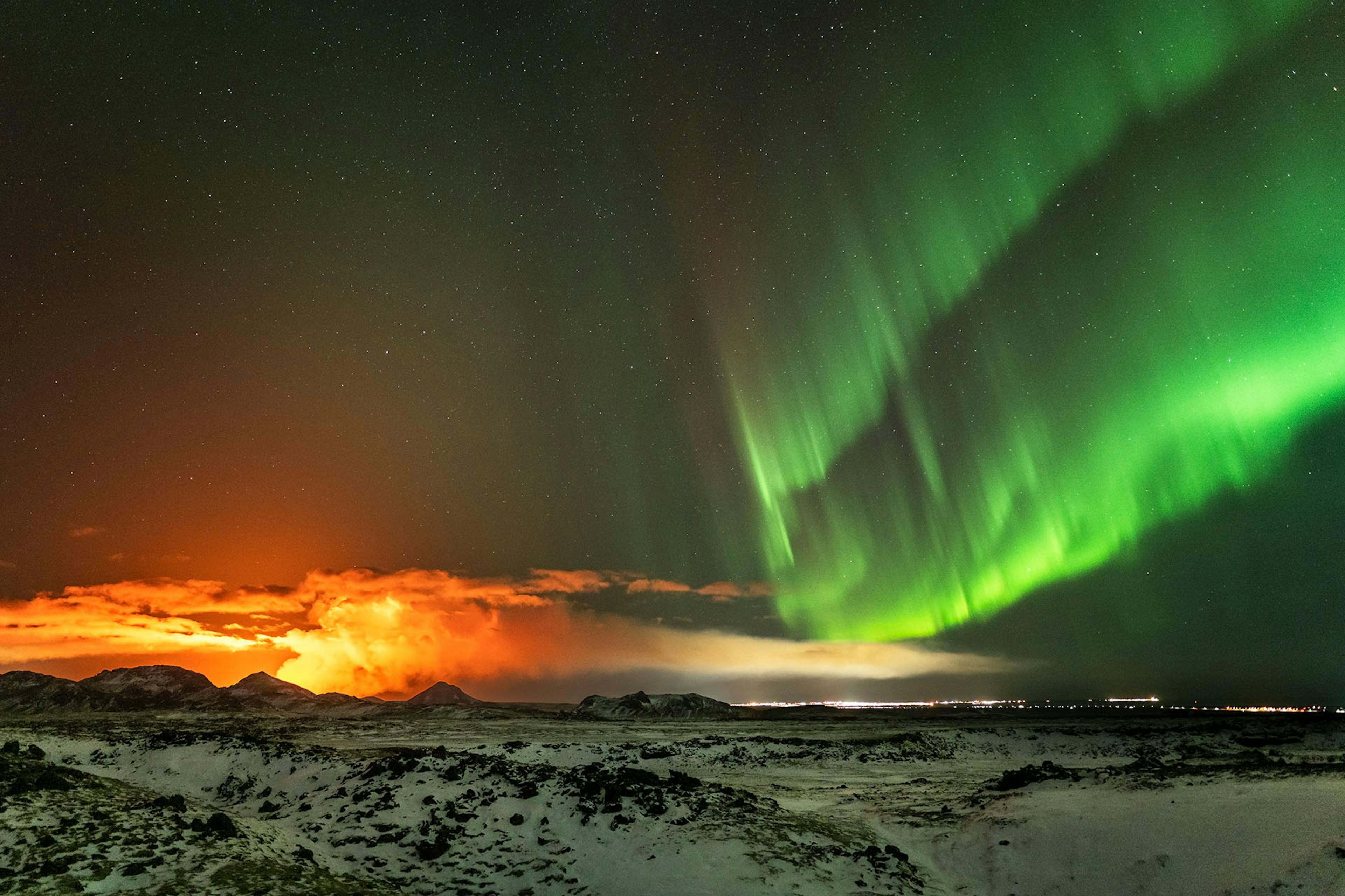 Volcanic eruption and Northern Lights over Reykjanes peninsula in November 2024. Credit: Gísli Már Árnason / Iceland at Night