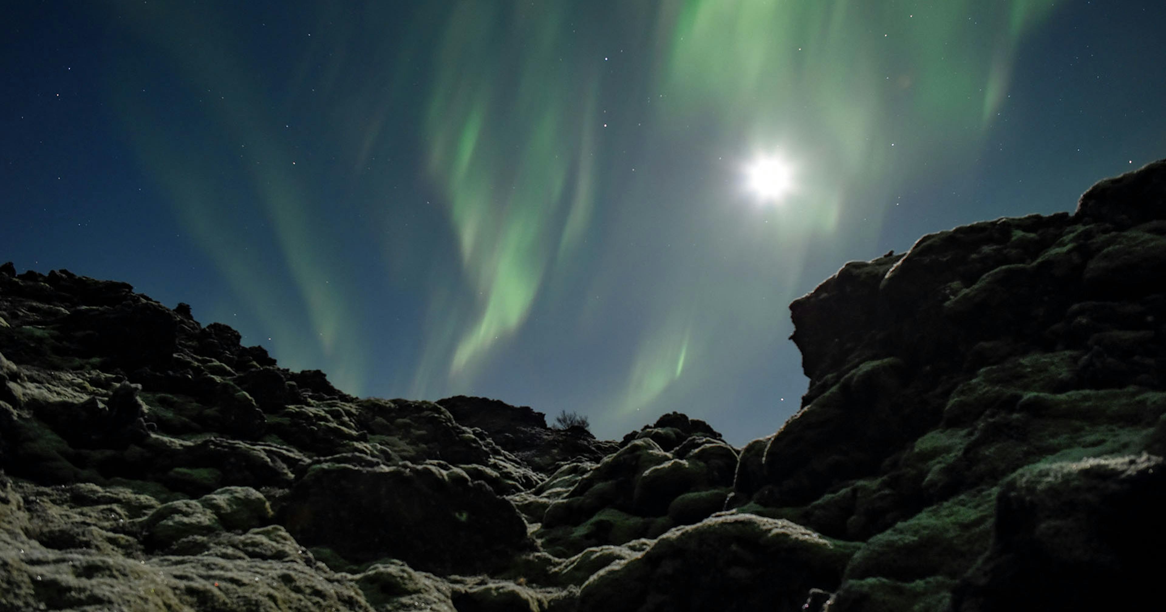 Northern Lights during full Moon. Credit: Gísli Már Árnason / Iceland at Night