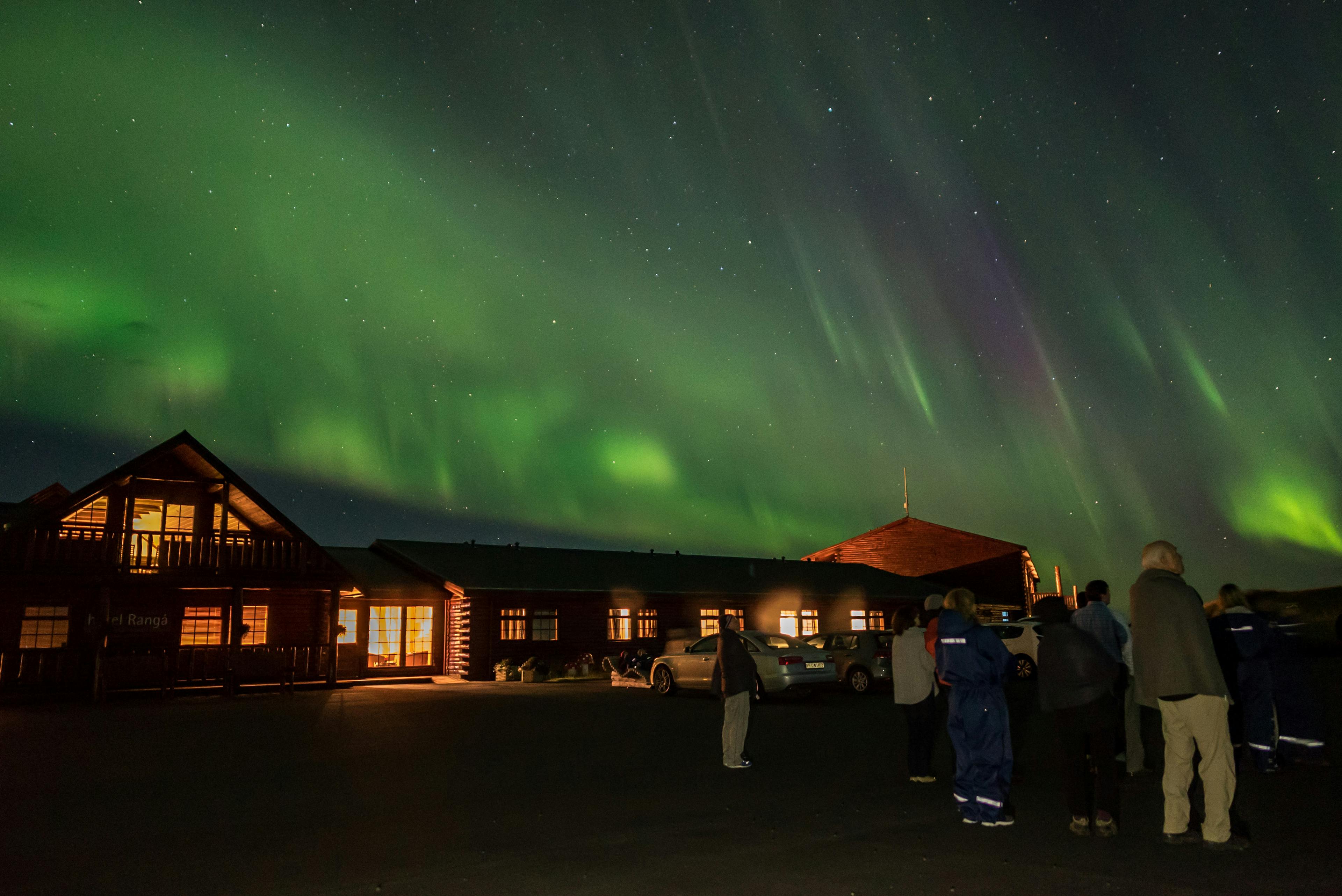 Guests watching the Northern Lights from Hótel Rangá