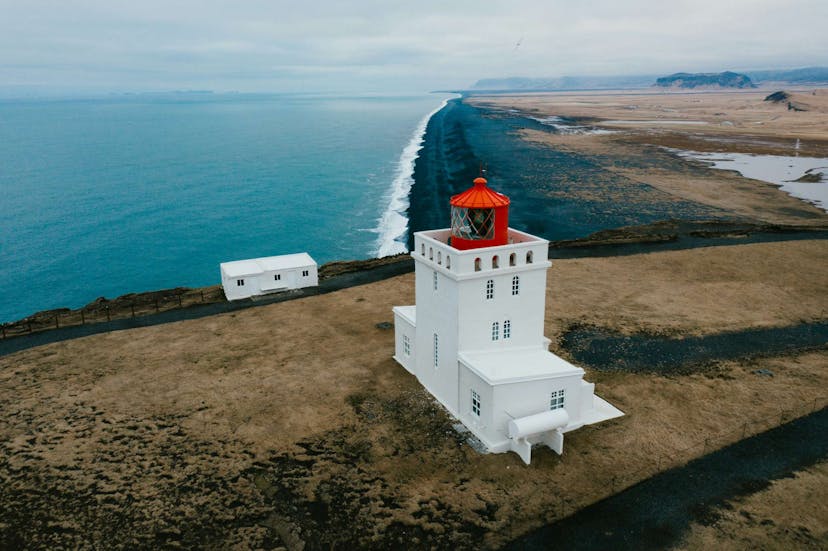Light house by Iceland's black sand beach