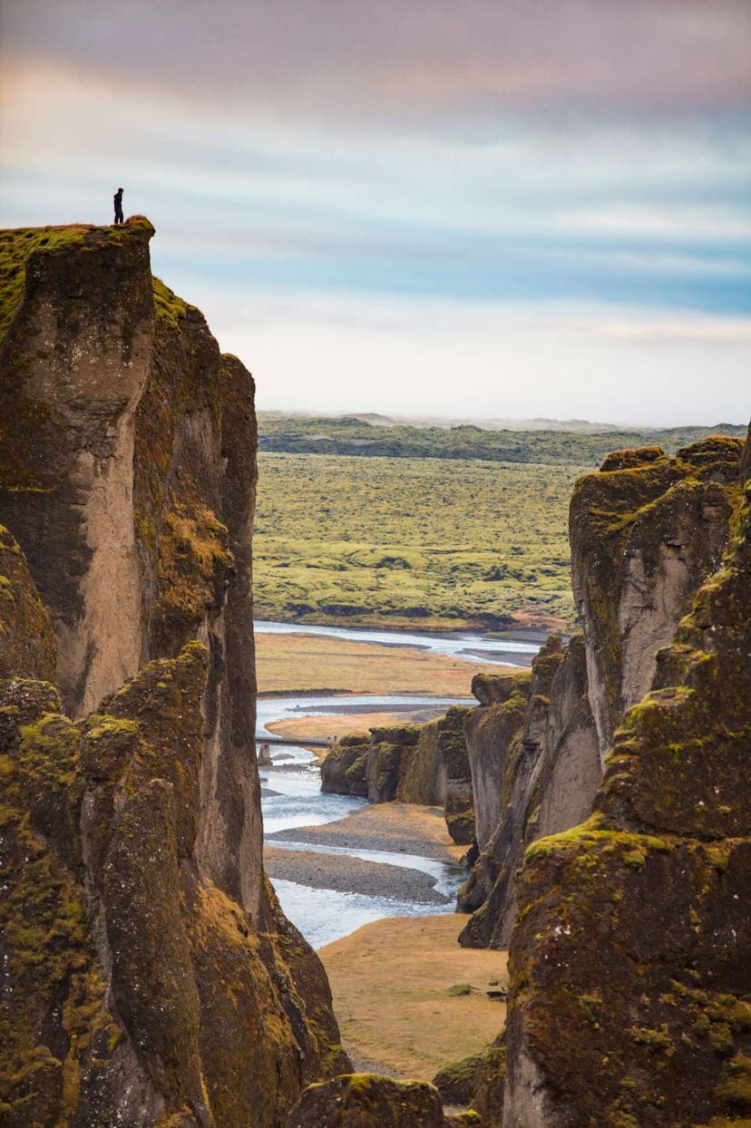 Man standing on cliff at Icelandic nature