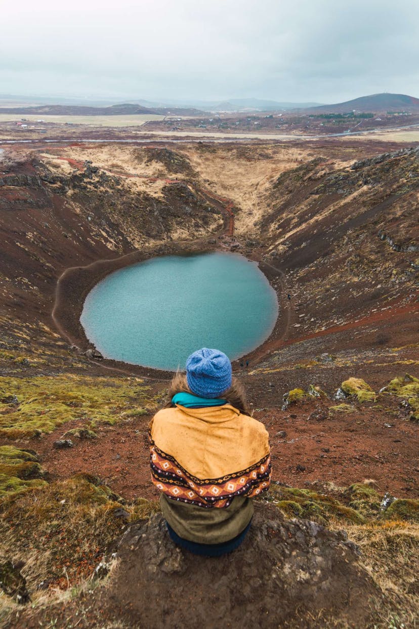 Woman sitting by Kerid crater