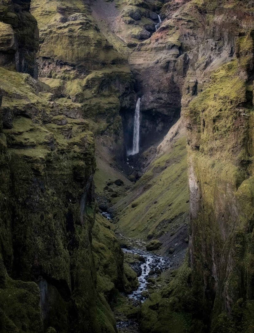 Beautiful green mountain with waterfall in Iceland