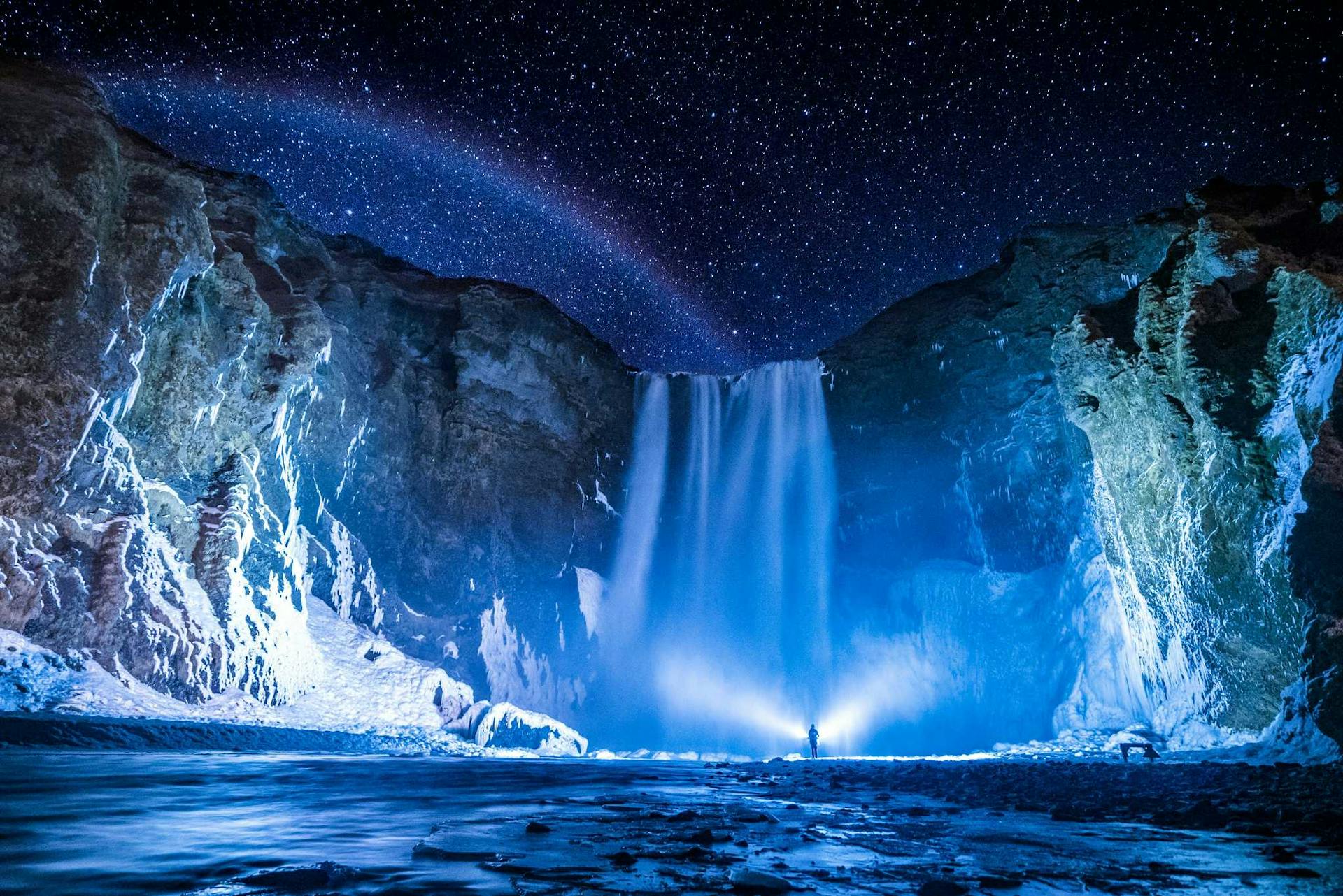 Skógafoss waterfall during a starry night