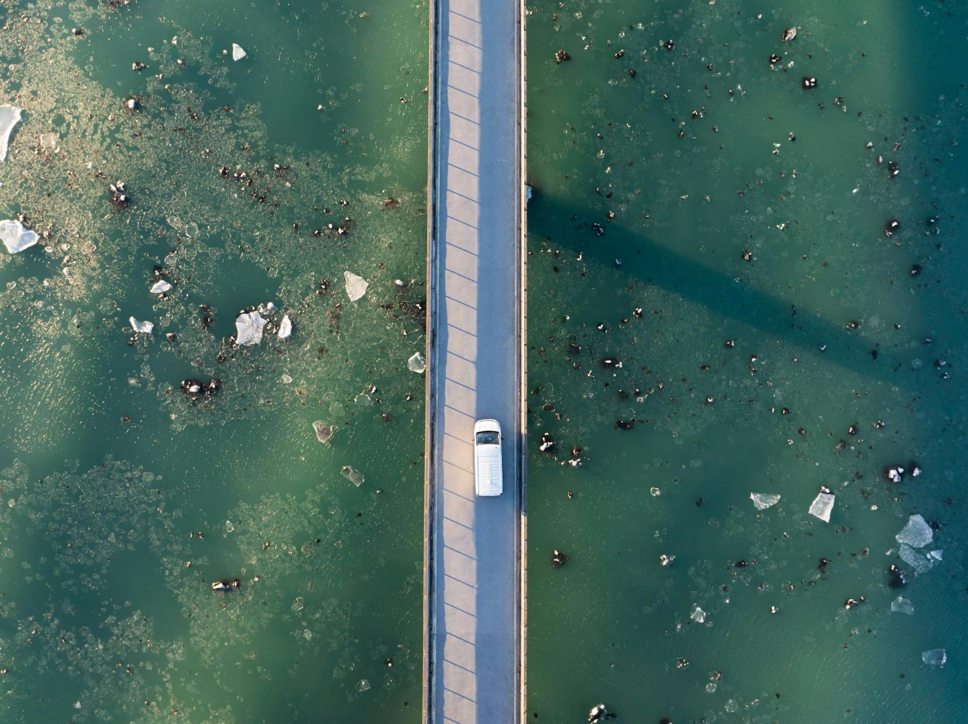 Iceland campervan driving over Glacier Lagoon bridge
