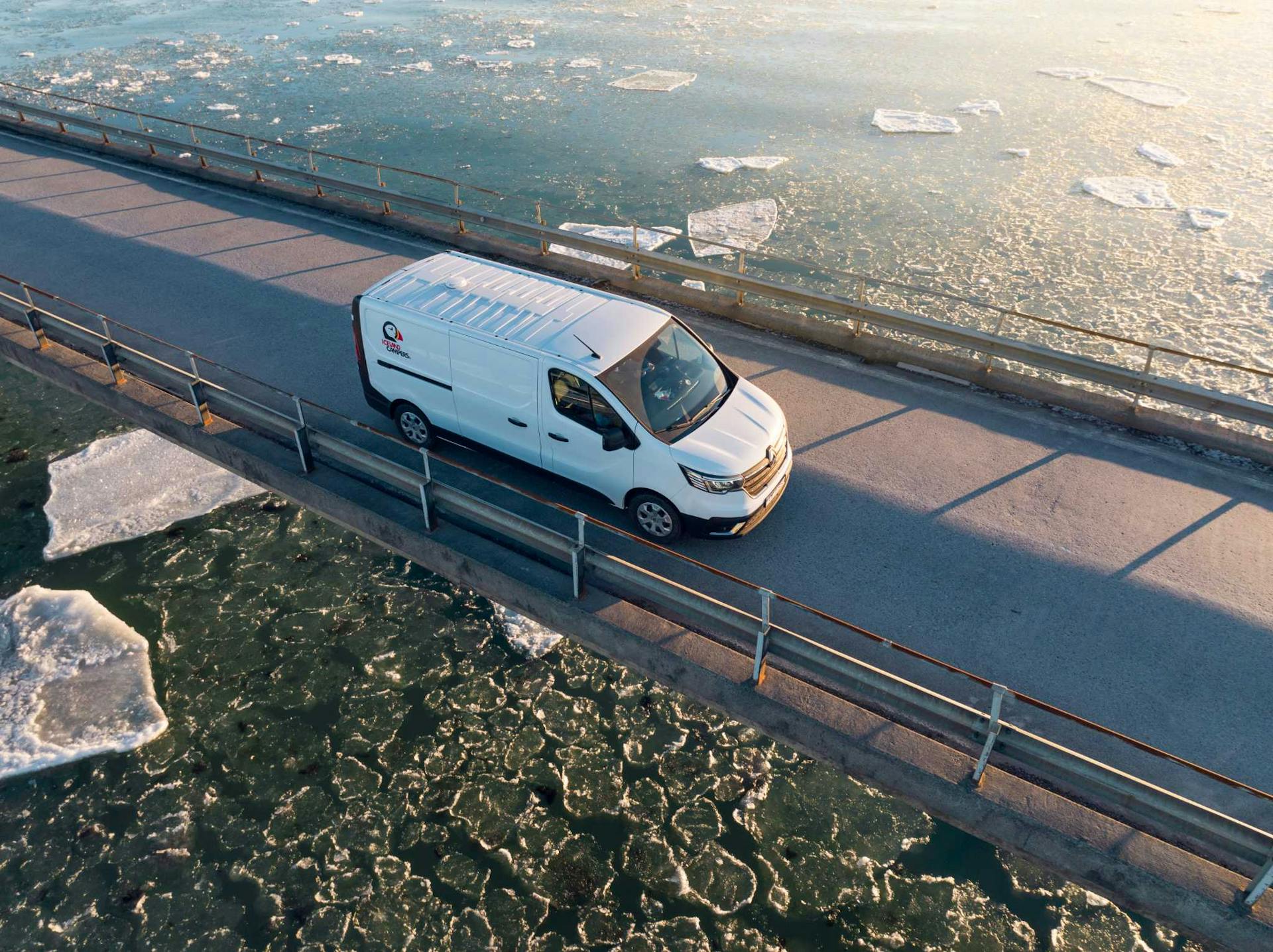 iceland campers, campervan driving on glacier lagoon bridge
