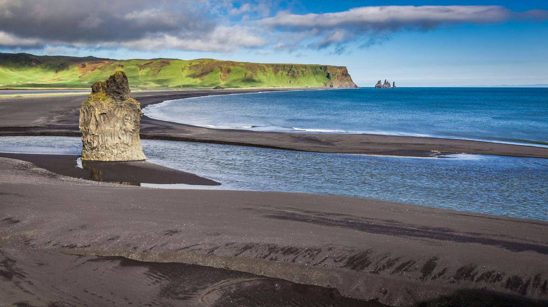 big rock on the black beach