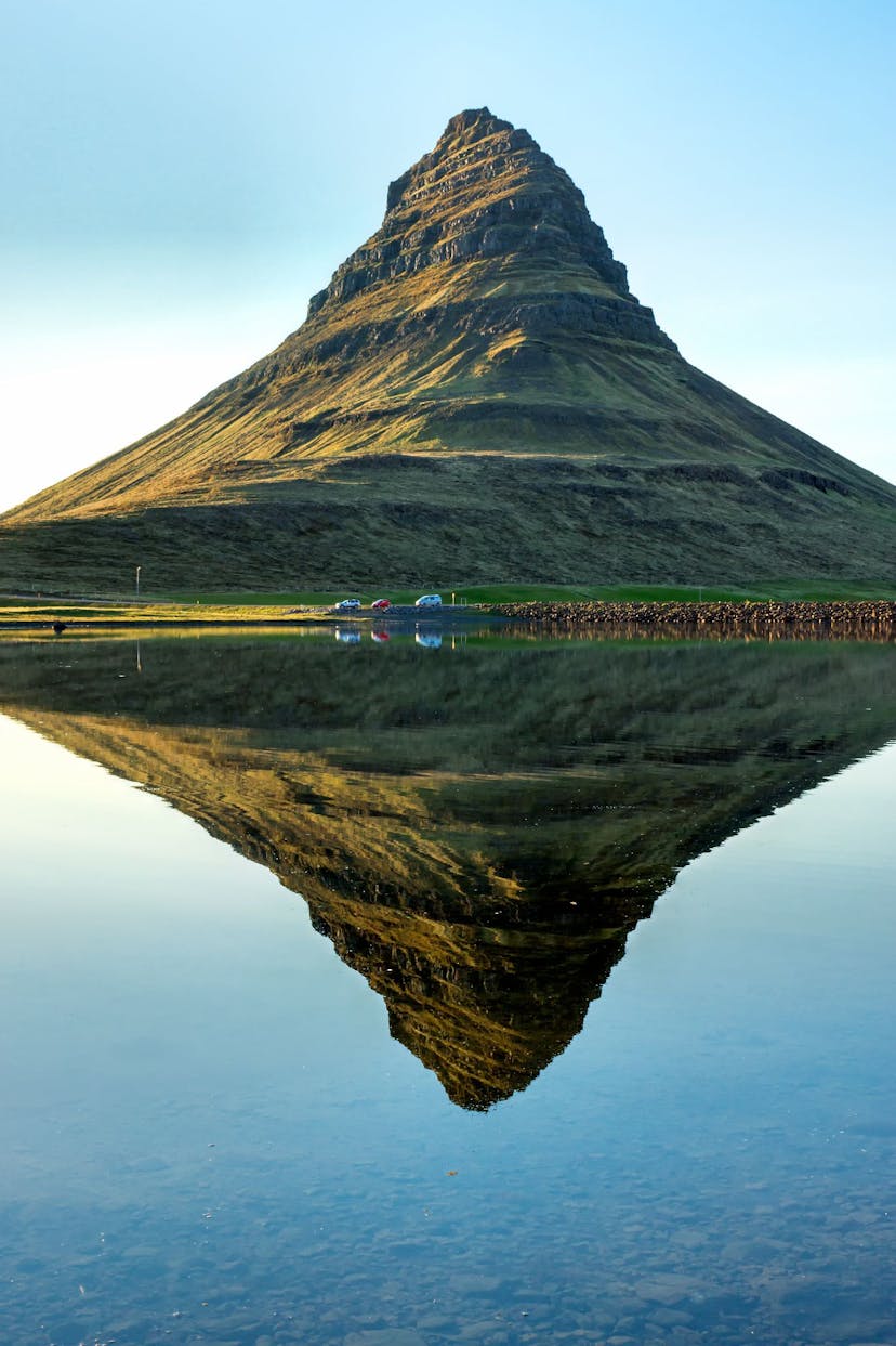 Kirkjufell mountain reflecting on water