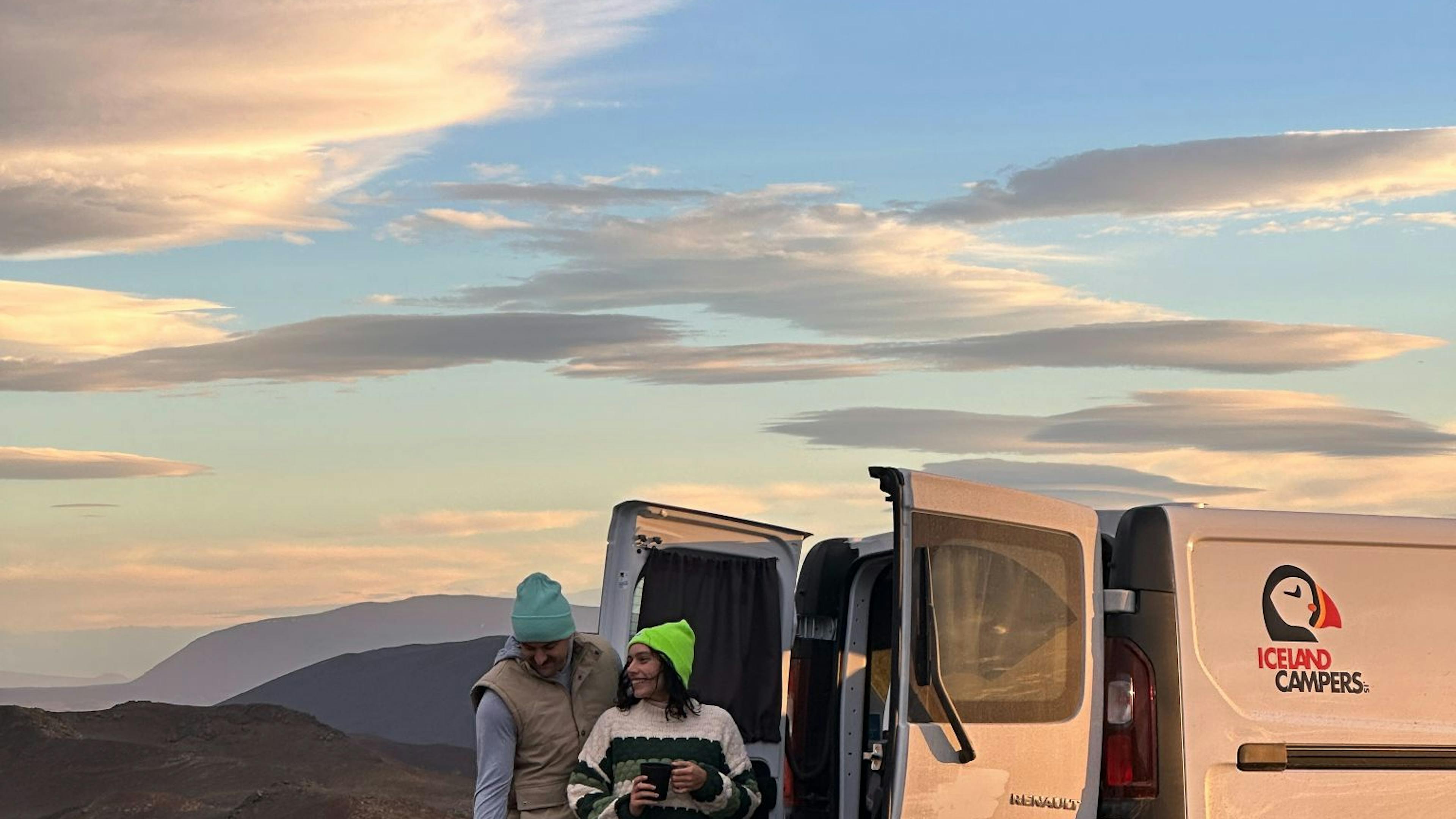 Couple camping with a campervan in Iceland