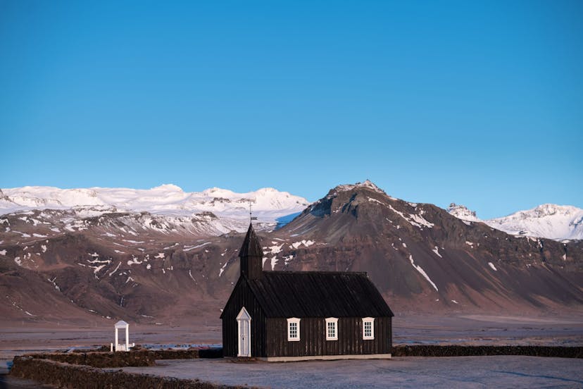 Icelandic church surrounded by mountains