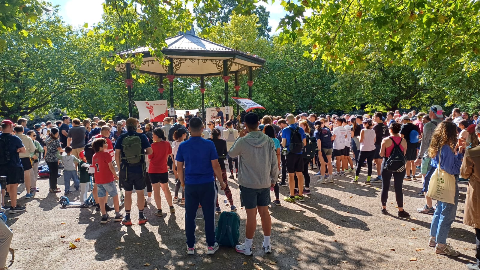 A group of people gathered in Battersea Park, London