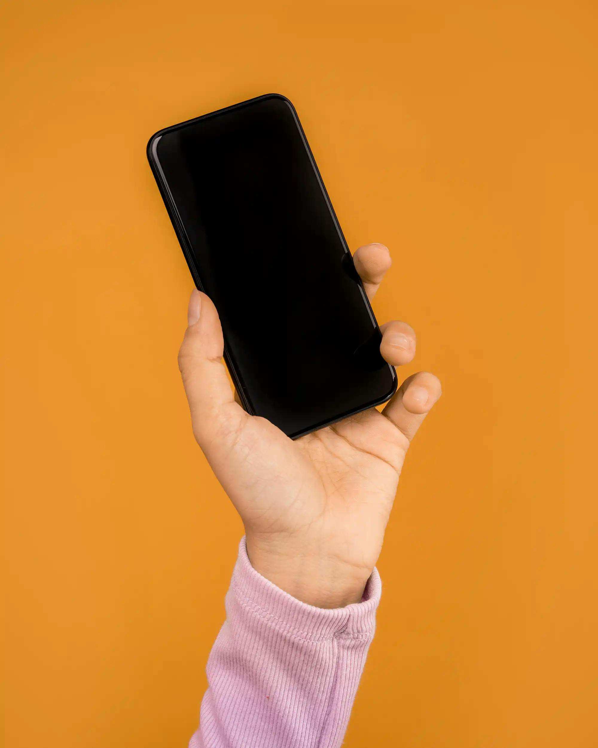 Person holding telephone