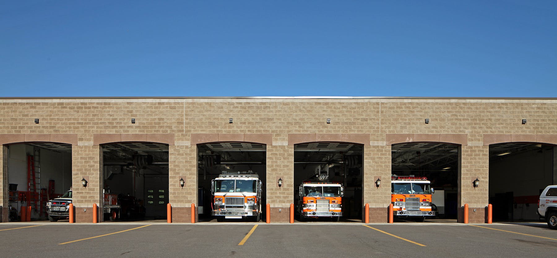 Marquette Township Fire Hall facade with trucks