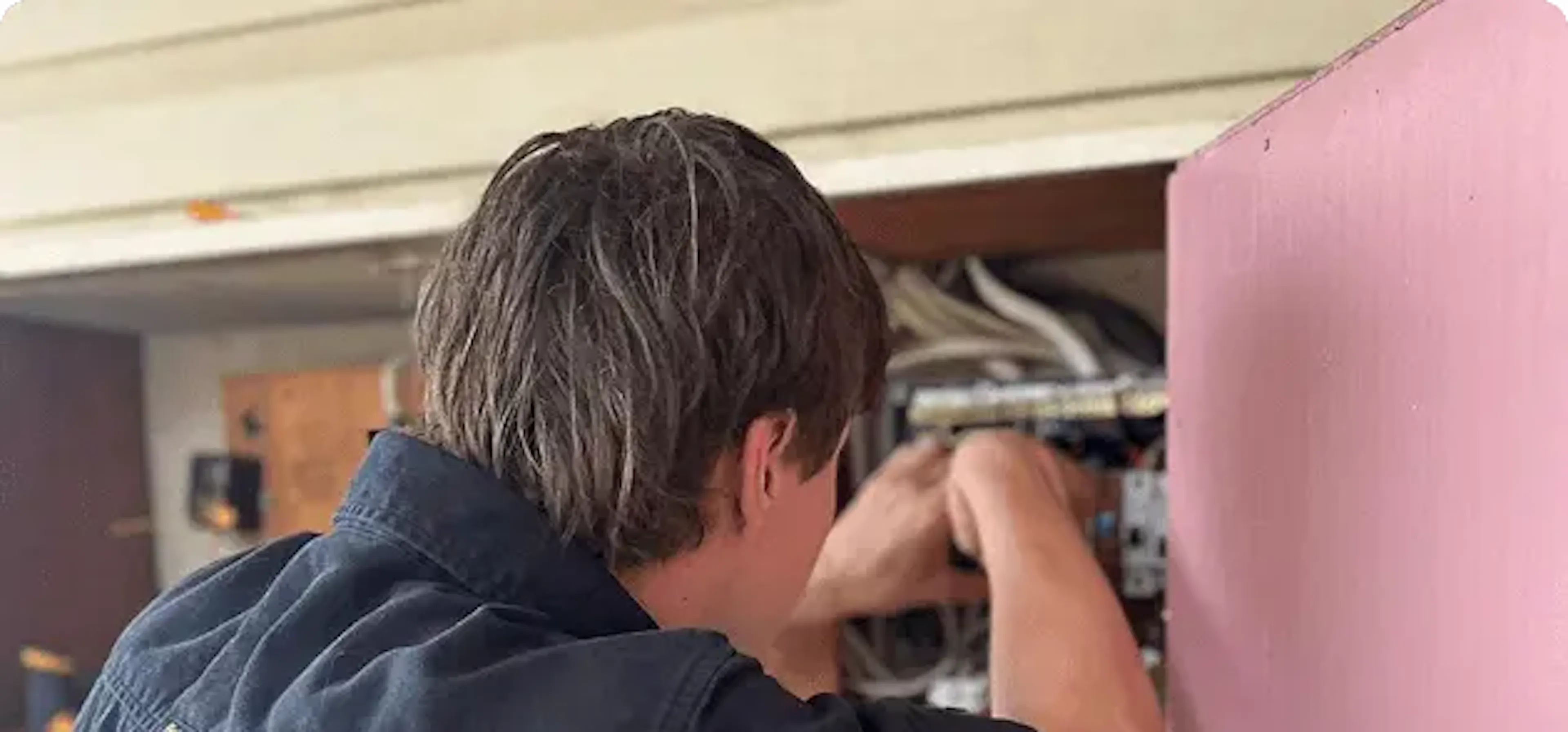 Impulse Electrical Enterprise electrician working on a home switchboard